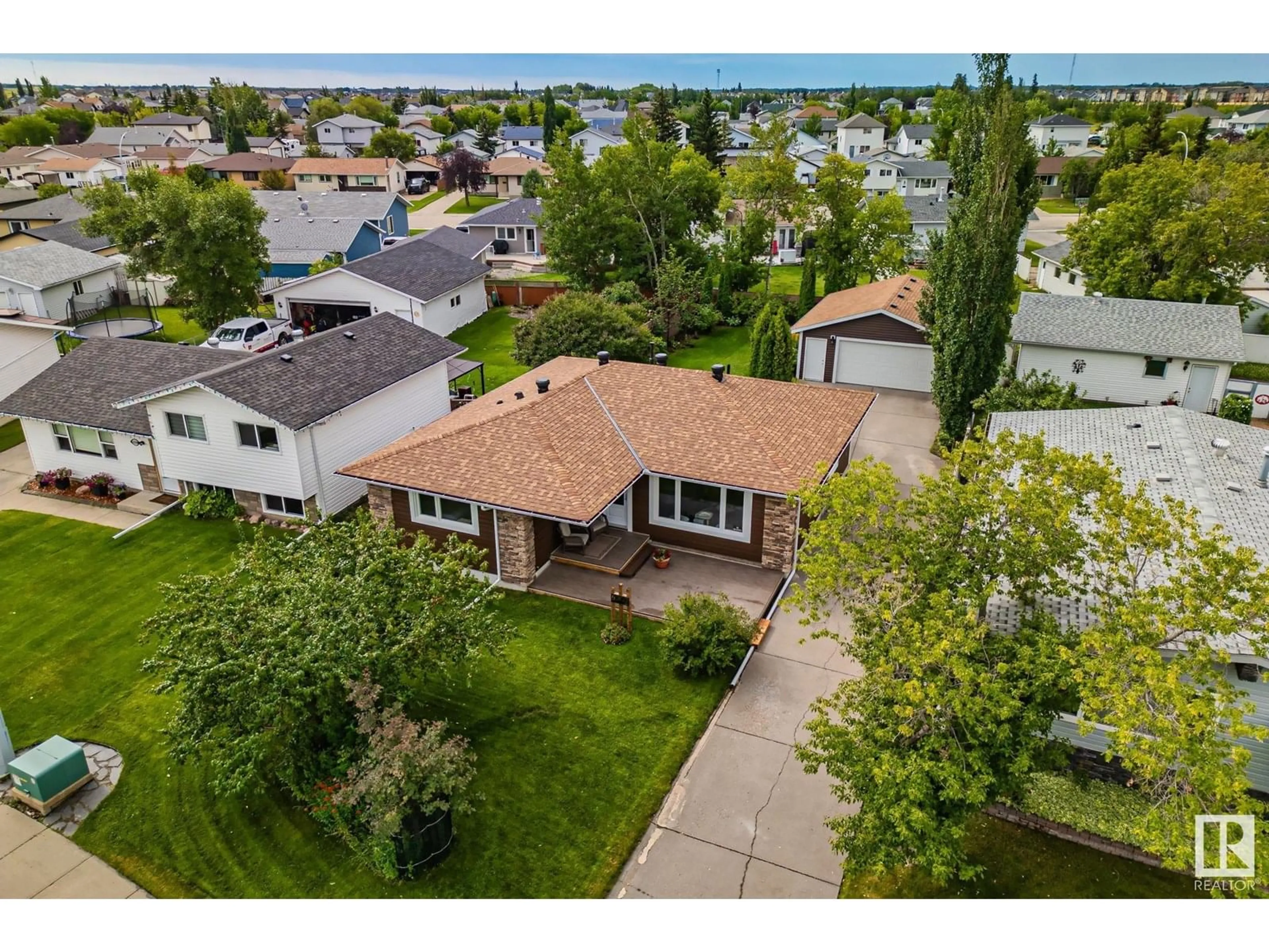 A pic from outside/outdoor area/front of a property/back of a property/a pic from drone, water/lake/river/ocean view for 4303 35 AV, Leduc Alberta T9E6A9