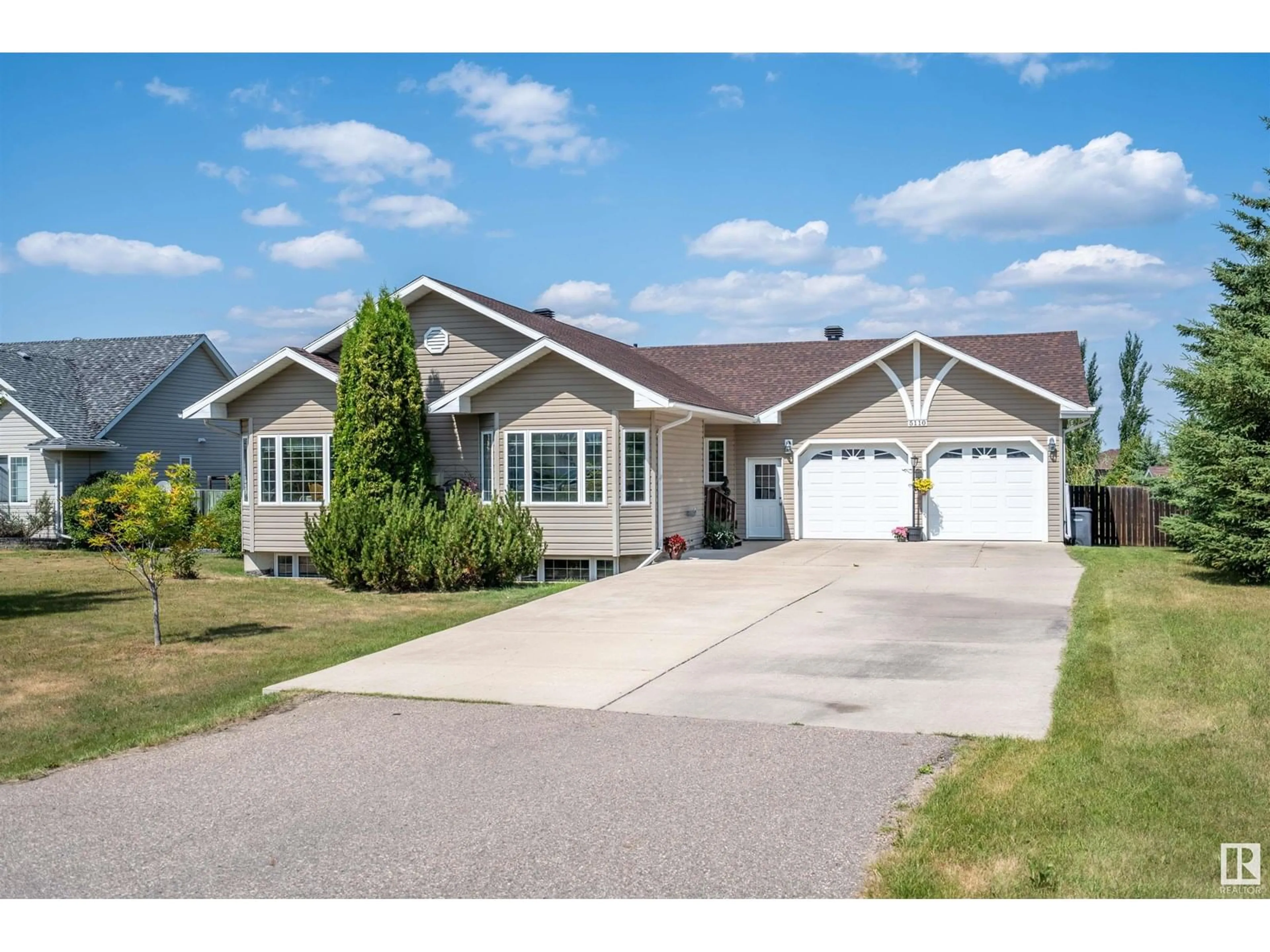 Home with vinyl exterior material, street for 5110 DRAKE DR, Cold Lake Alberta T9M1P8