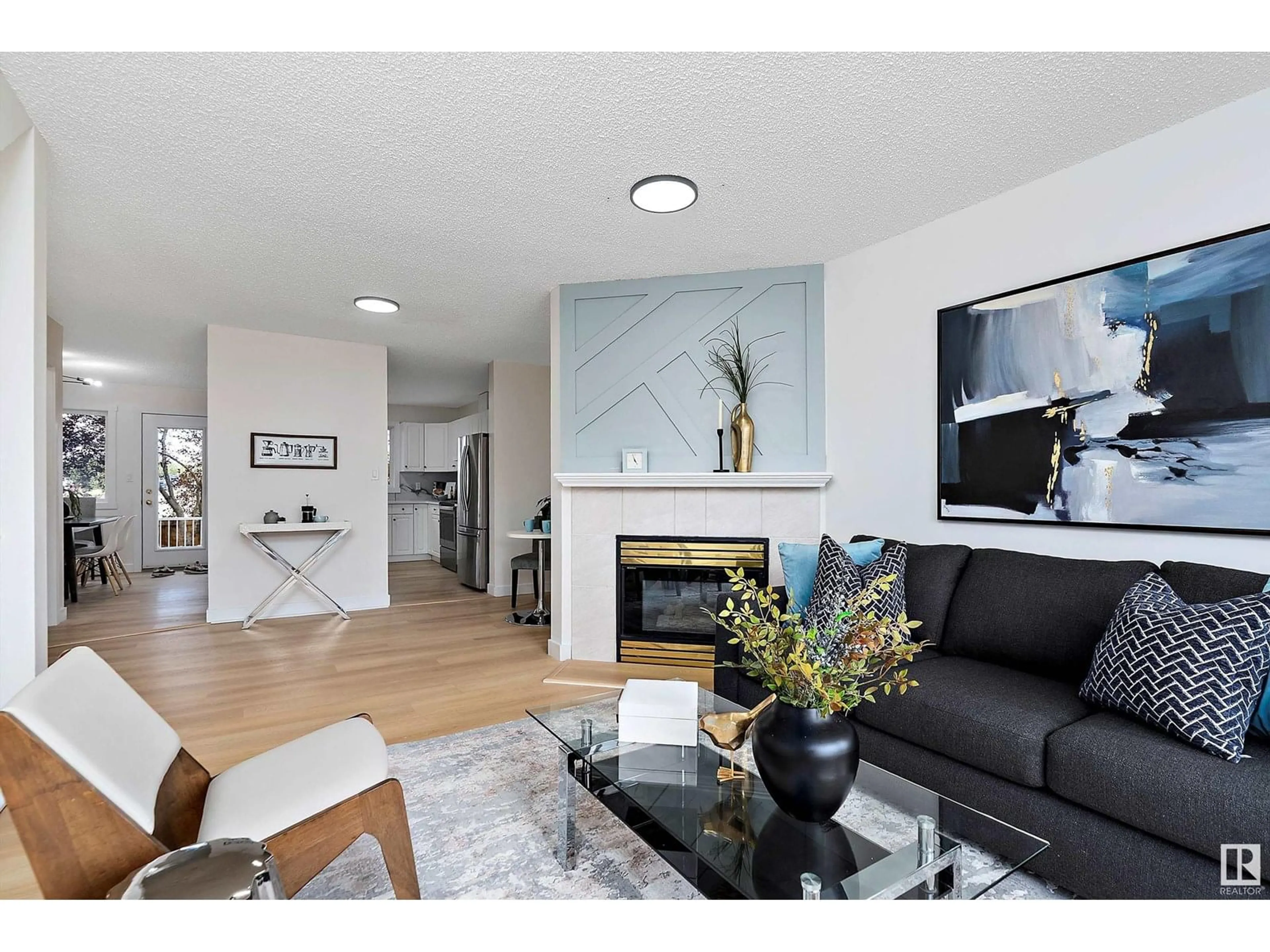 Living room with furniture, wood/laminate floor for 14 - 11105 9 AV, Edmonton Alberta T6J6Z4