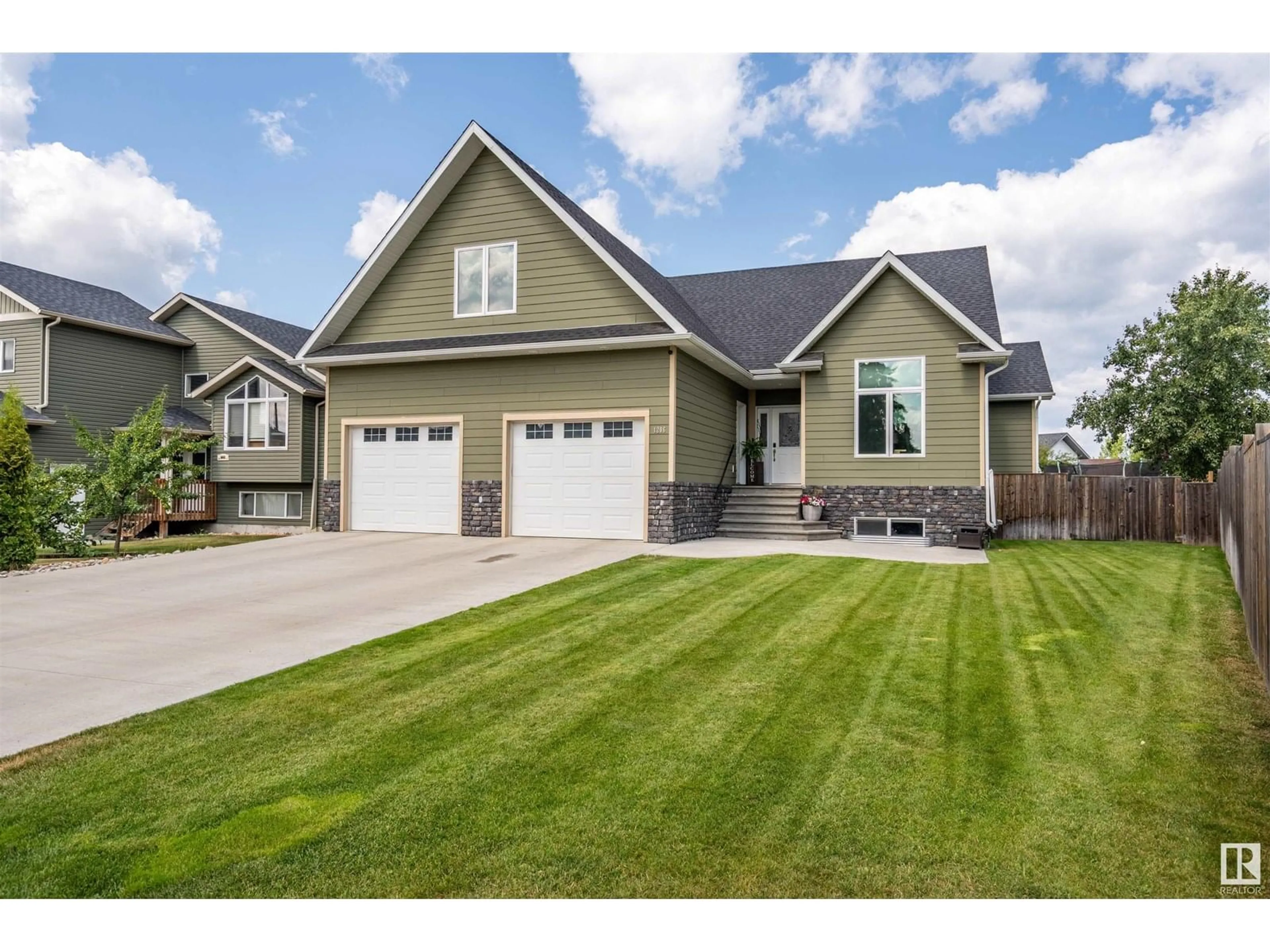 Home with vinyl exterior material, street for 1206 18 AV, Cold Lake Alberta T9M0G4