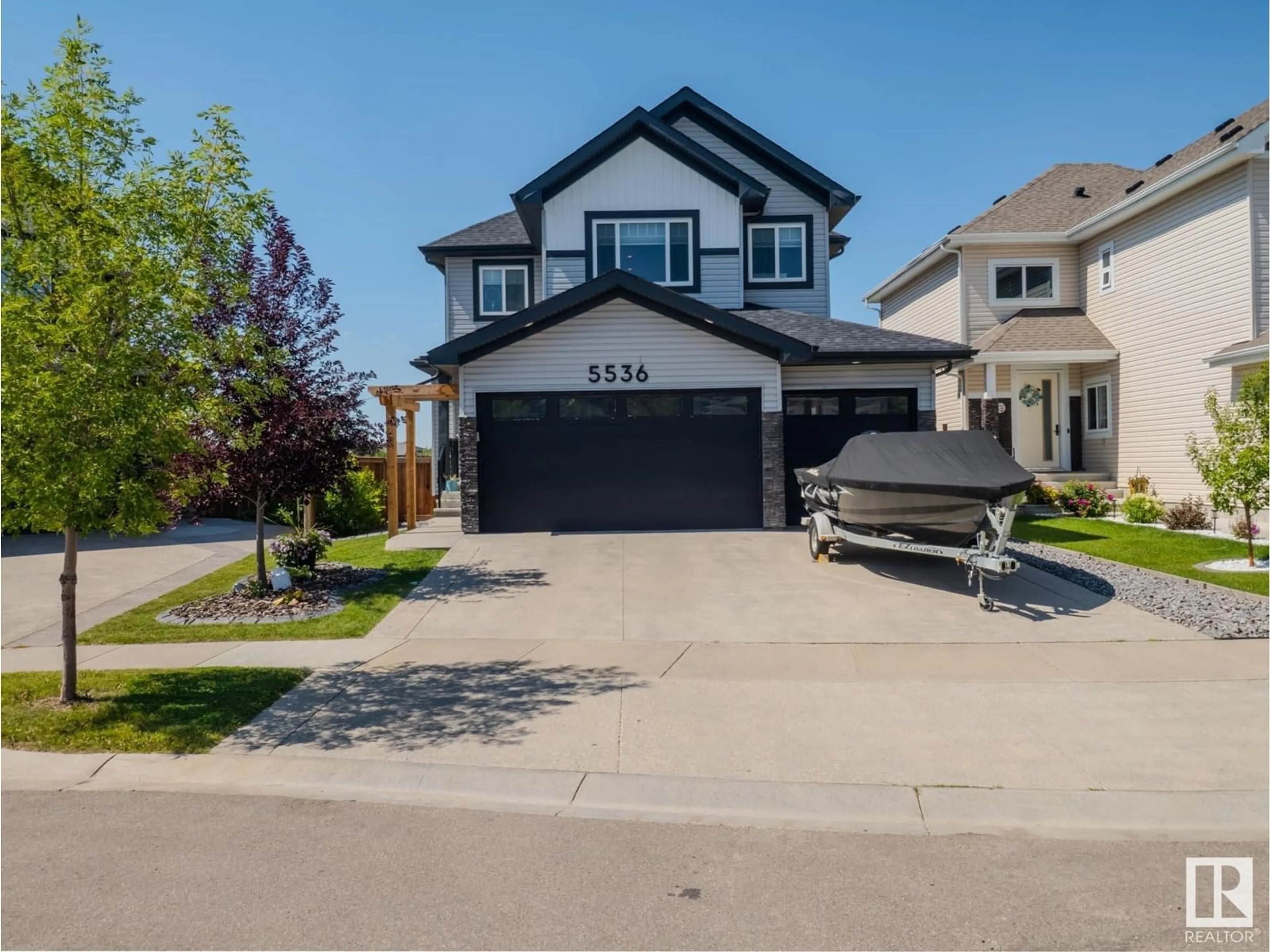 Home with vinyl exterior material, street for 5536 POIRIER WAY, Beaumont Alberta T4X2B3