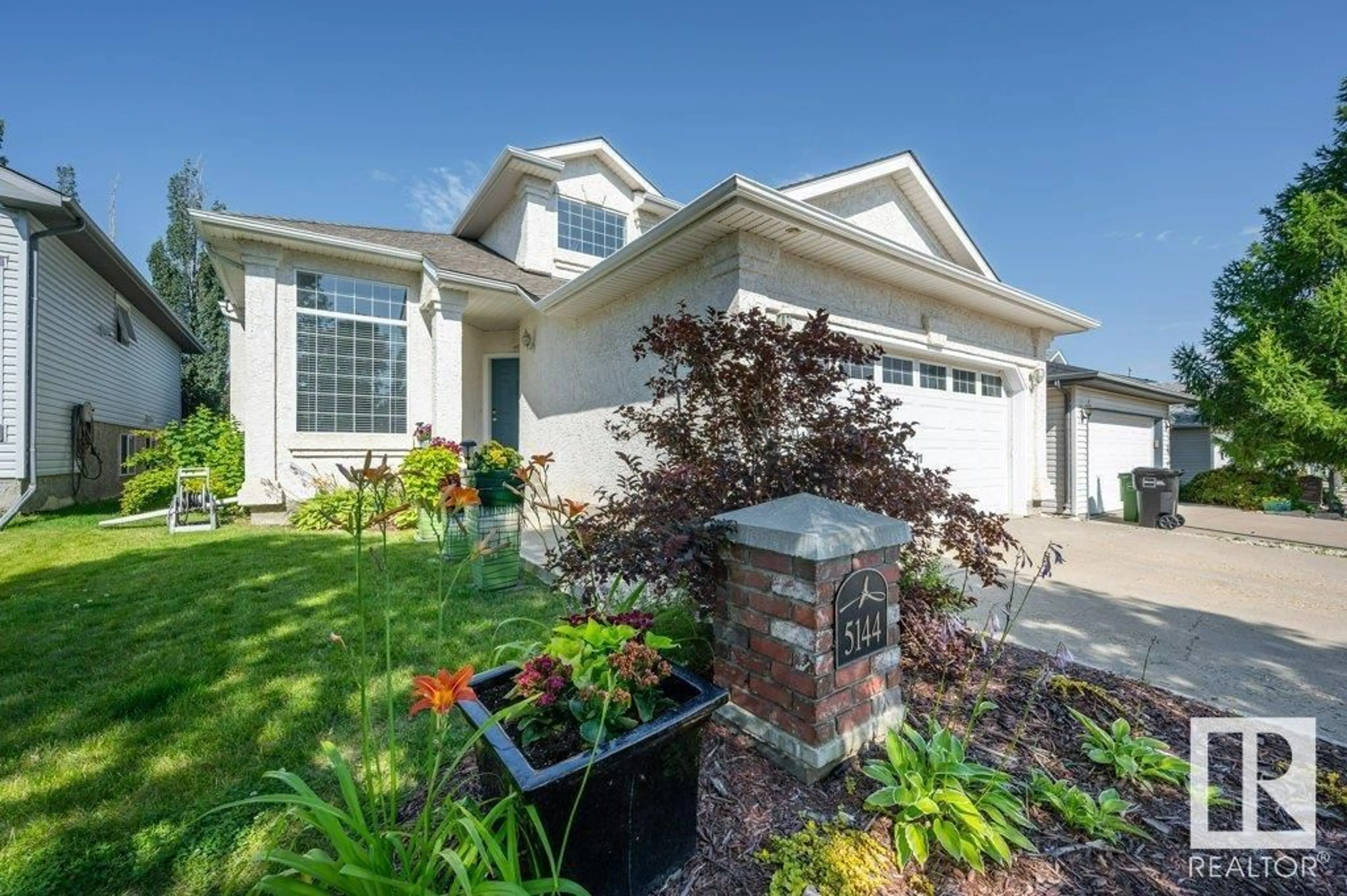 Home with vinyl exterior material, street for NW - 5144 191 ST, Edmonton Alberta T6M2R4
