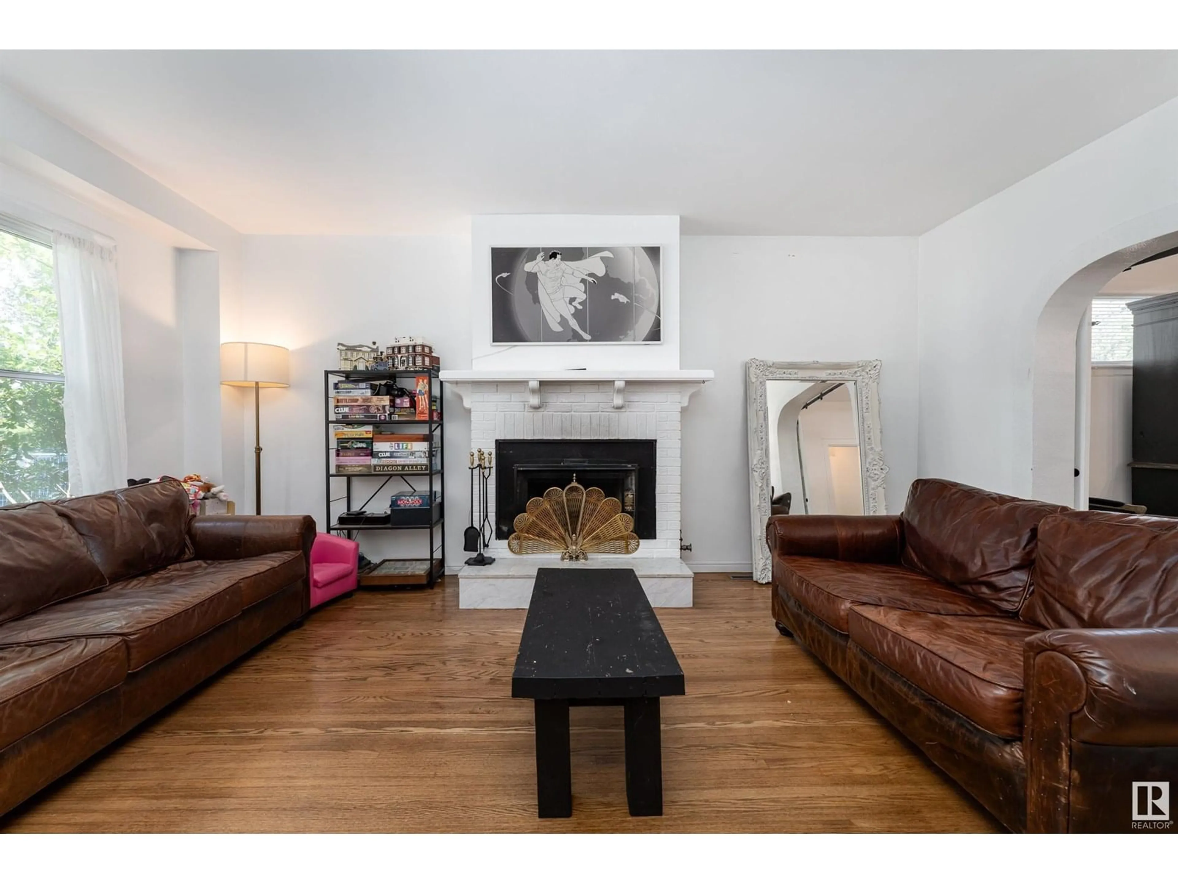 Living room with furniture, wood/laminate floor for NW - 10523 127 ST, Edmonton Alberta T5N1V8