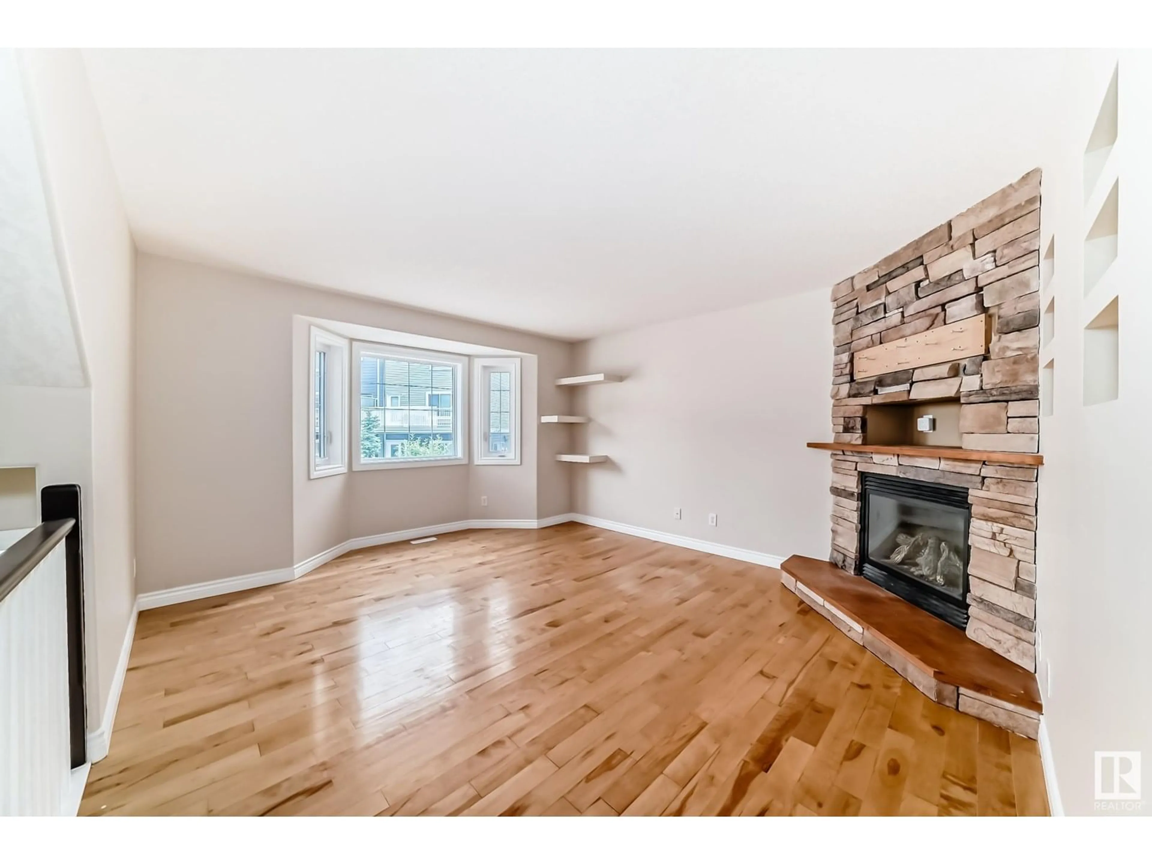 Living room with furniture, wood/laminate floor for #2 - 17839 99 ST, Edmonton Alberta T5X6A6