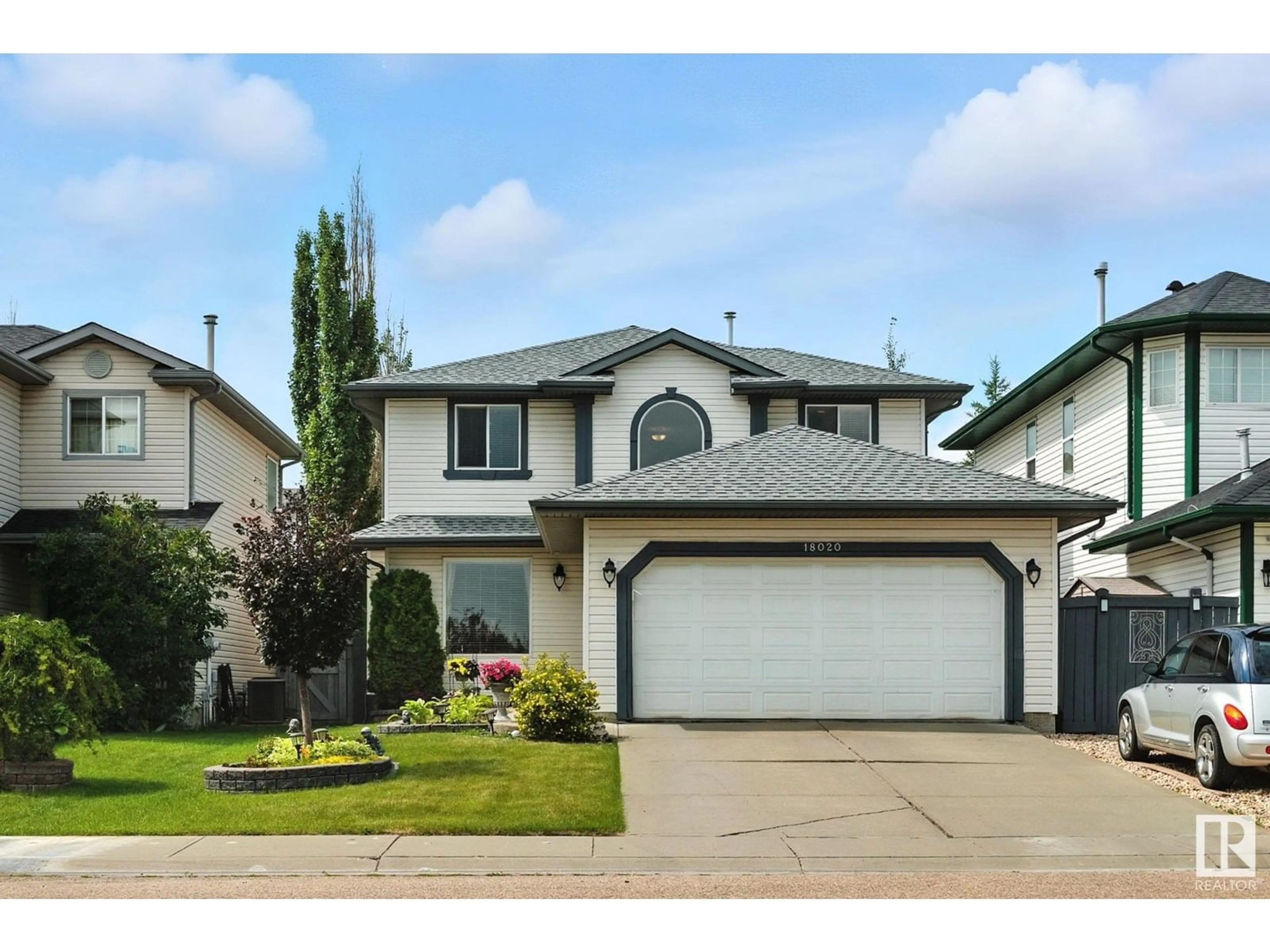 Home with vinyl exterior material, street for NW - 18020 101 ST, Edmonton Alberta T5X5Z8