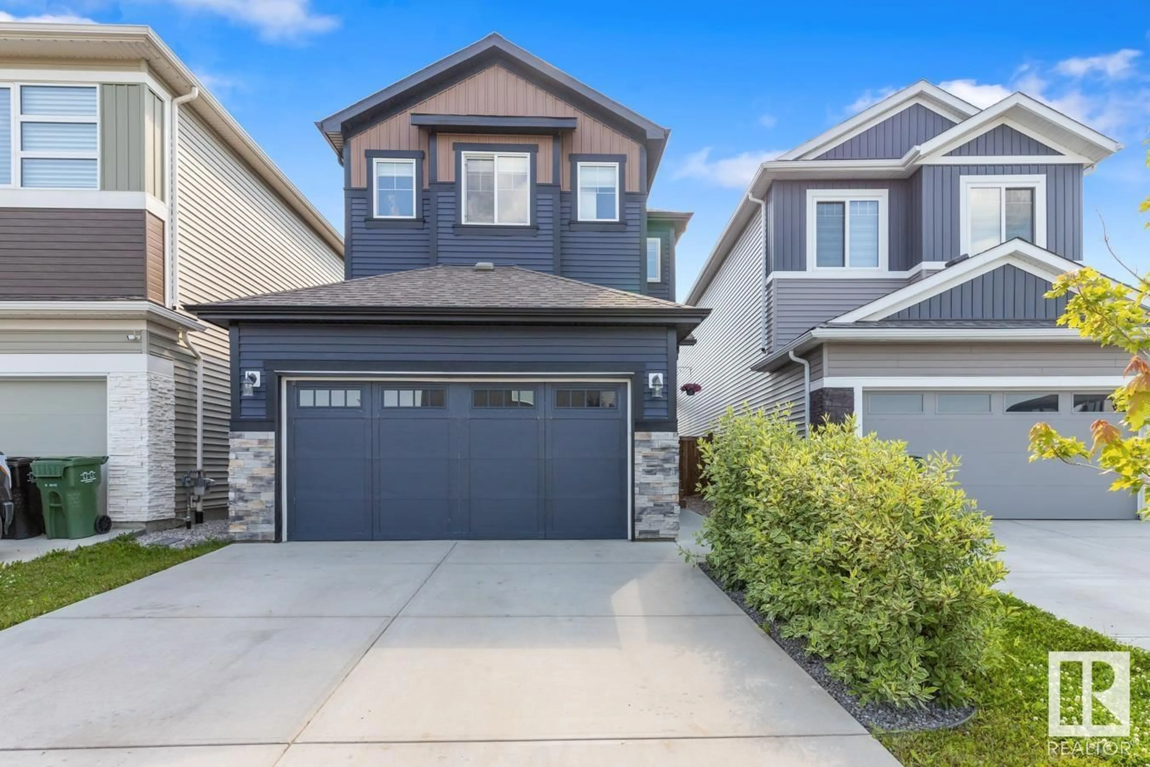 Home with vinyl exterior material, street for 1009 BERG PL, Leduc Alberta T9E1J7
