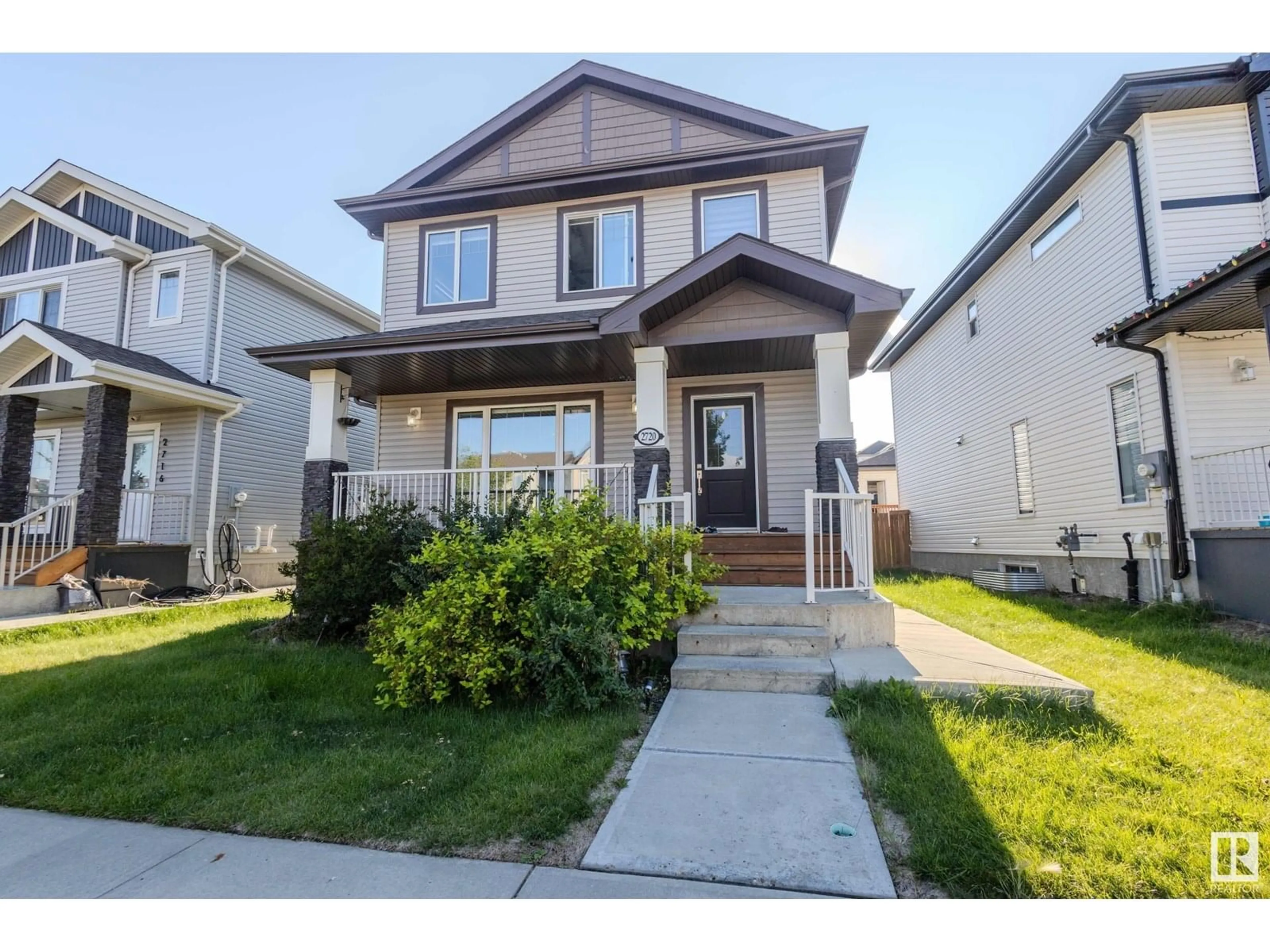 Home with vinyl exterior material, street for 2720 11 ST, Edmonton Alberta T6T0X9
