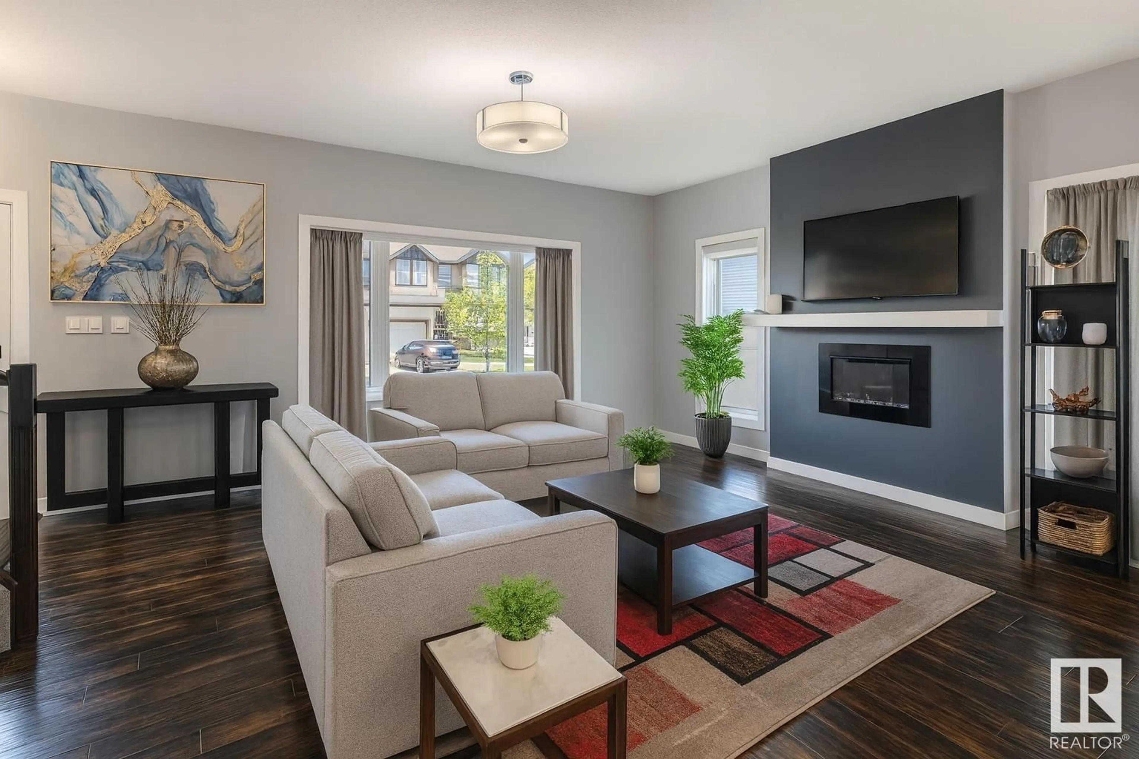 Living room with furniture, wood/laminate floor for 2720 11 ST, Edmonton Alberta T6T0X9