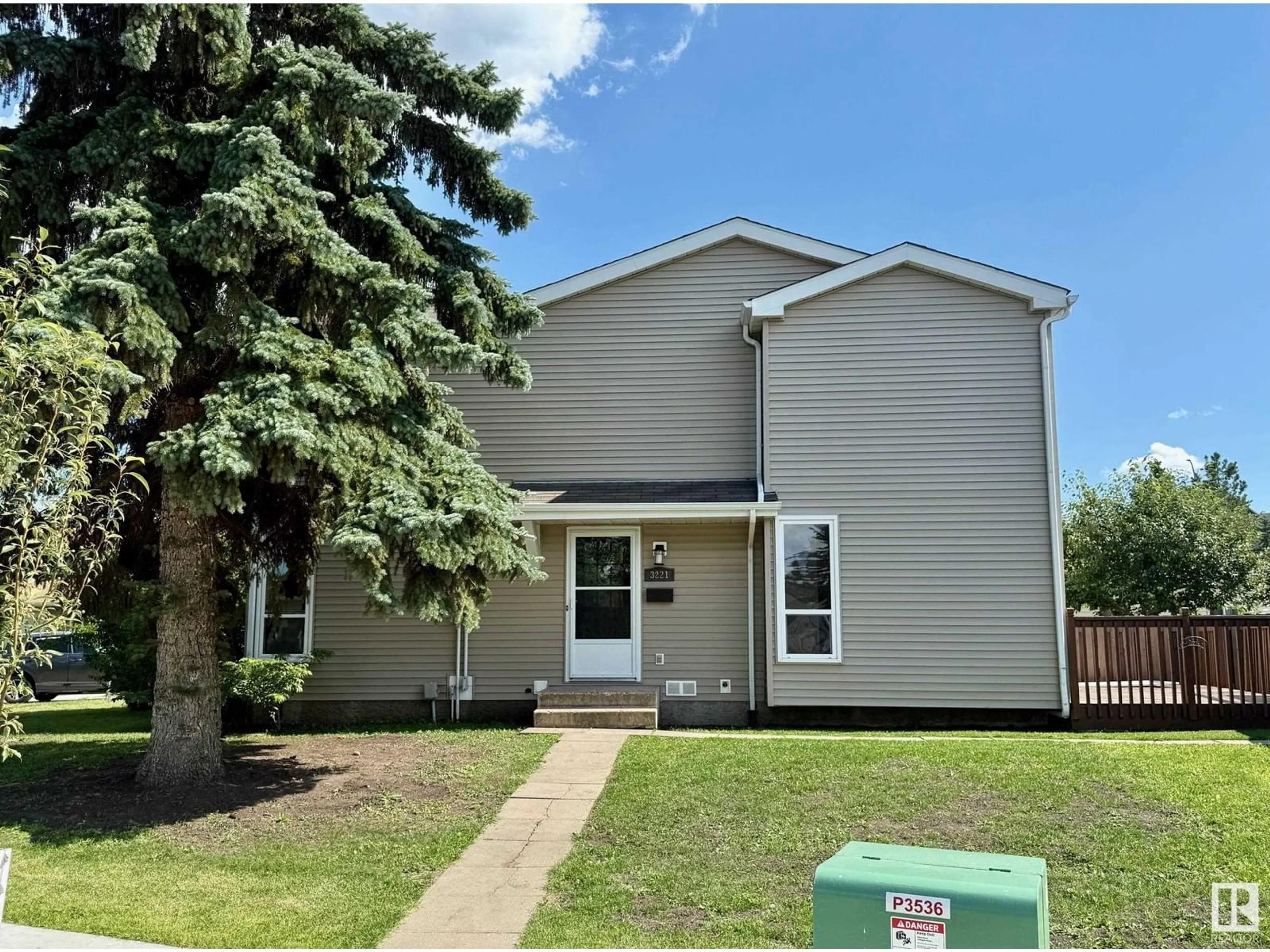 Home with vinyl exterior material, street for NW - 3221 138 AV, Edmonton Alberta T5Y1P2