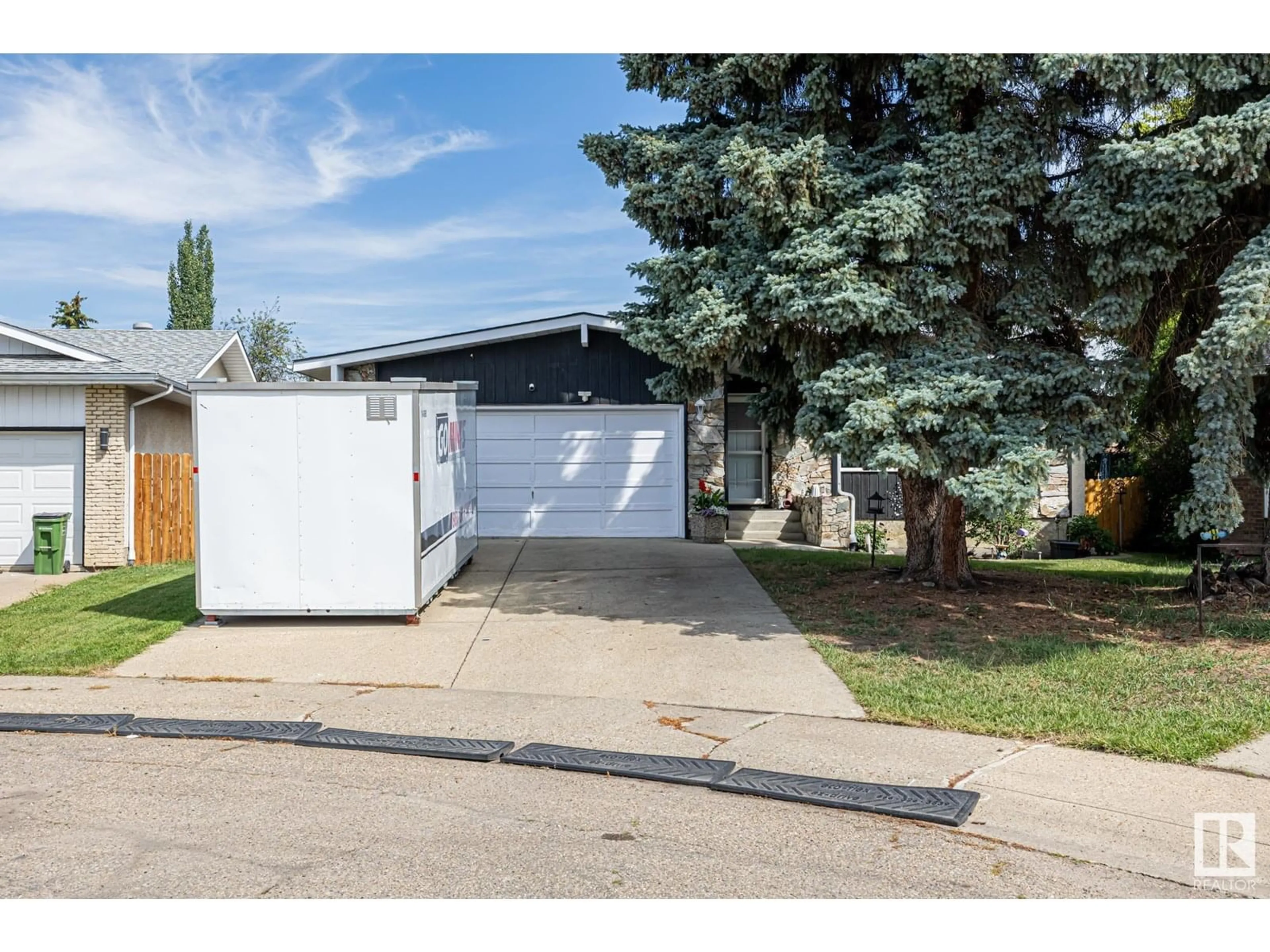 Home with vinyl exterior material, street for 12250 143 AV, Edmonton Alberta T5X3R7