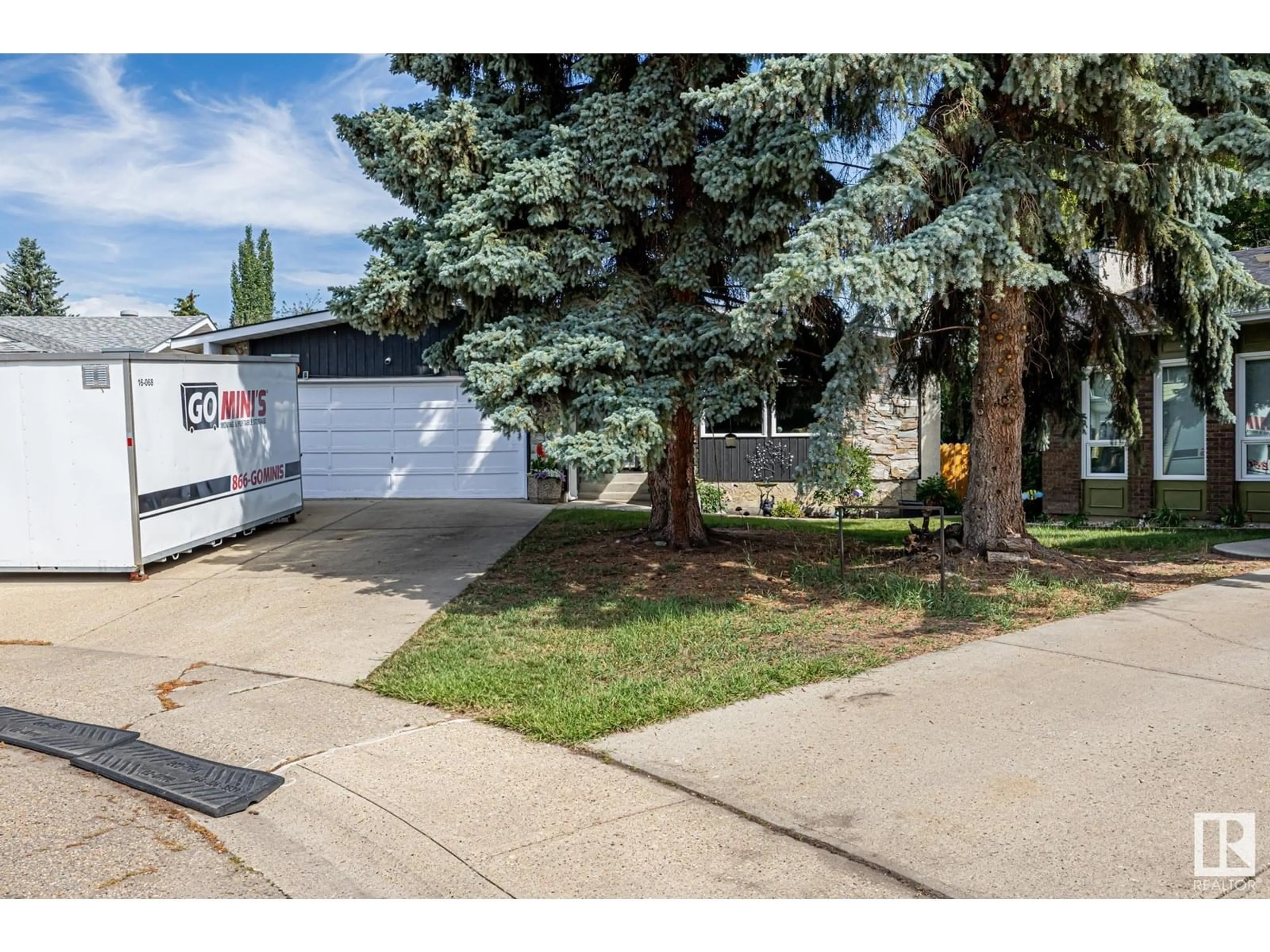 Home with vinyl exterior material, street for 12250 143 AV, Edmonton Alberta T5X3R7