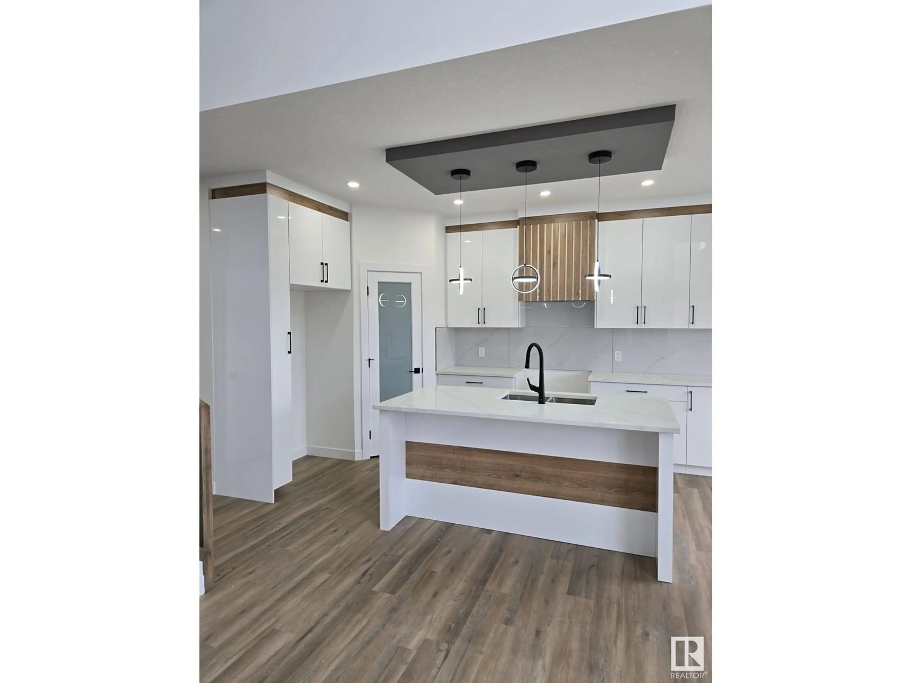 Open concept kitchen, wood/laminate floor for 3907 36 ST, Beaumont Alberta T4X3H2