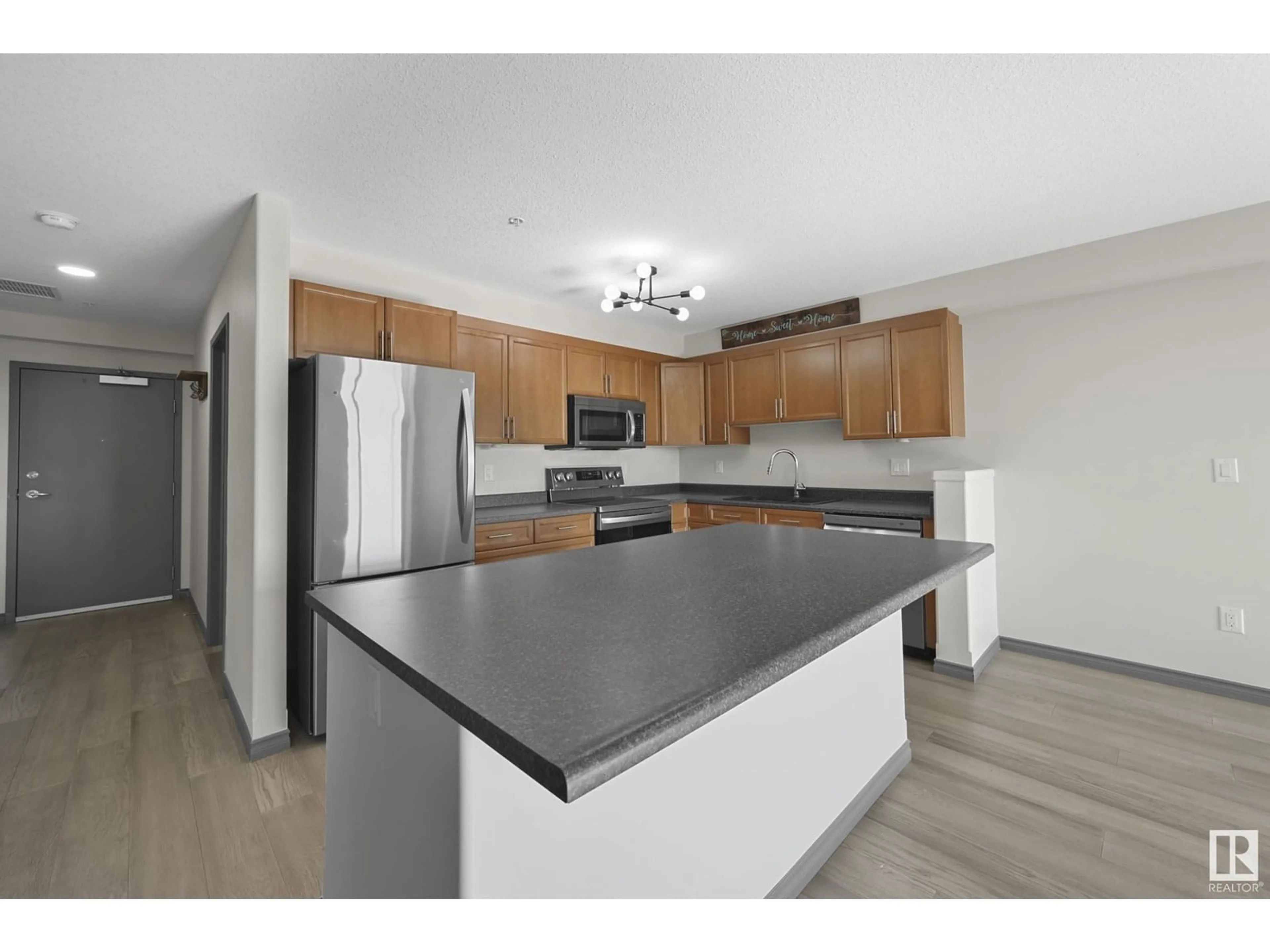 Open concept kitchen, unknown for 216 - 1589 GLASTONBURY BV, Edmonton Alberta T5T2V1