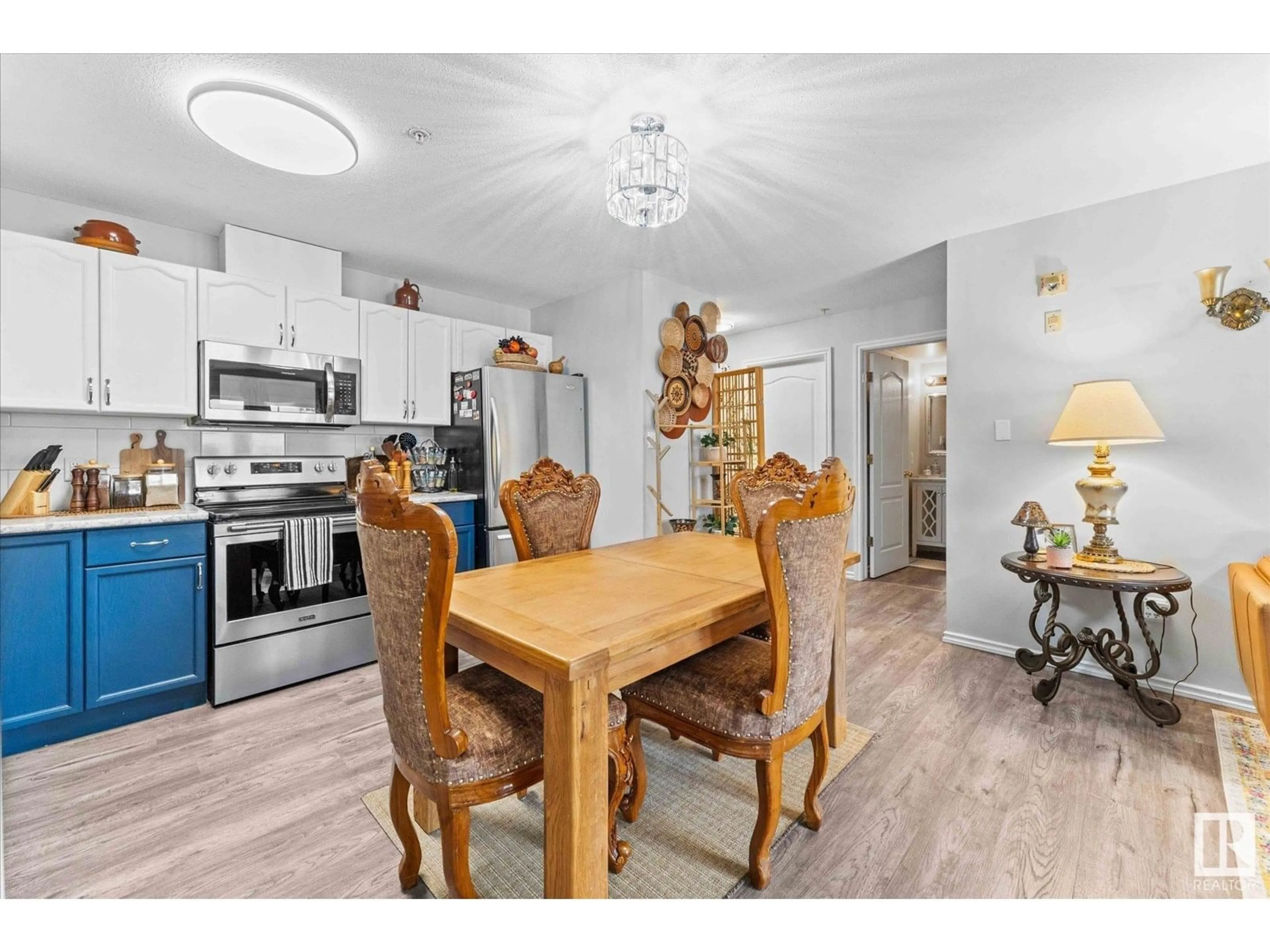 Open concept kitchen, wood/laminate floor for #102 - 4703 43 AV, Stony Plain Alberta T7Z2S7