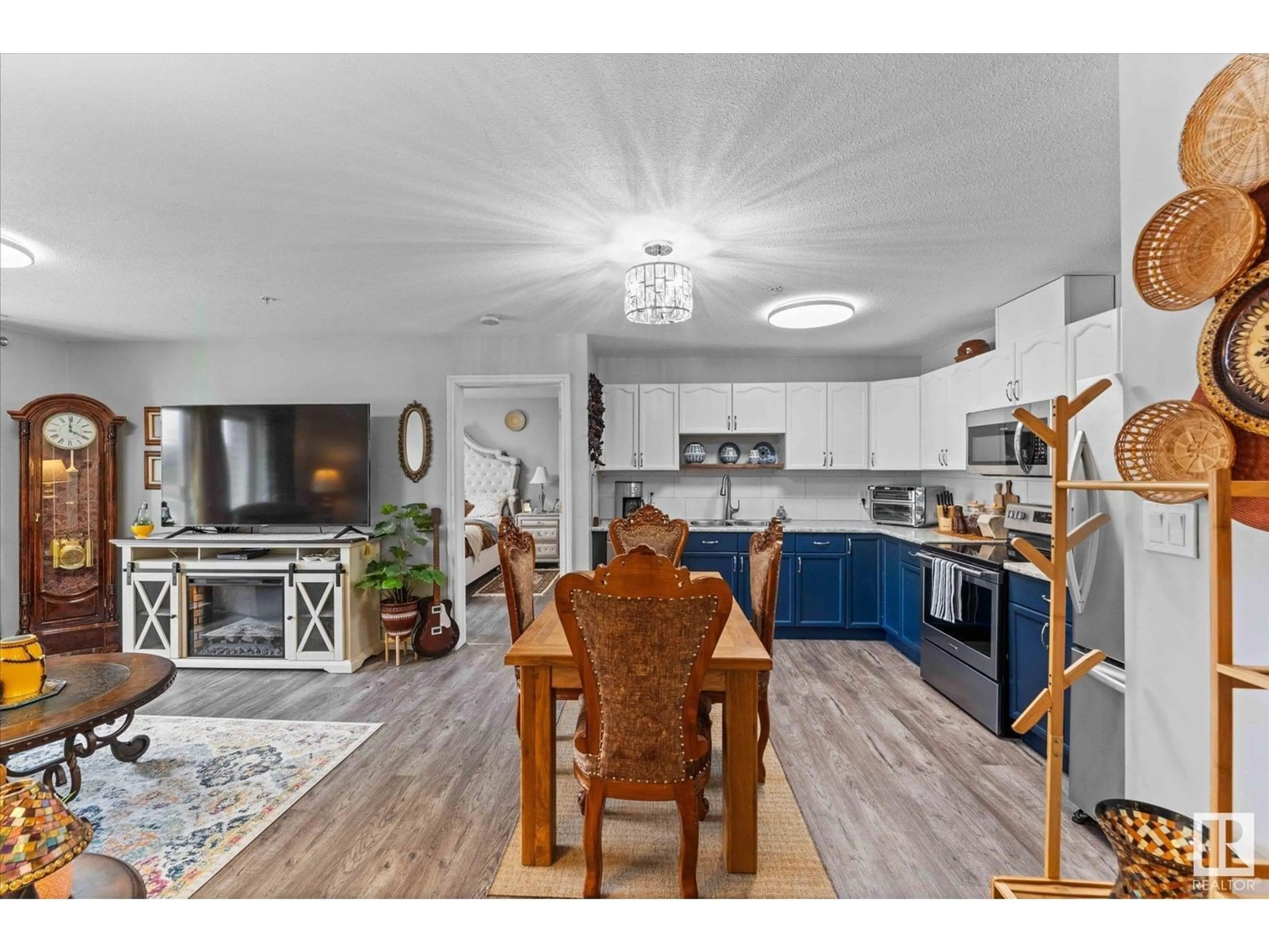 Open concept kitchen, wood/laminate floor for #102 - 4703 43 AV, Stony Plain Alberta T7Z2S7