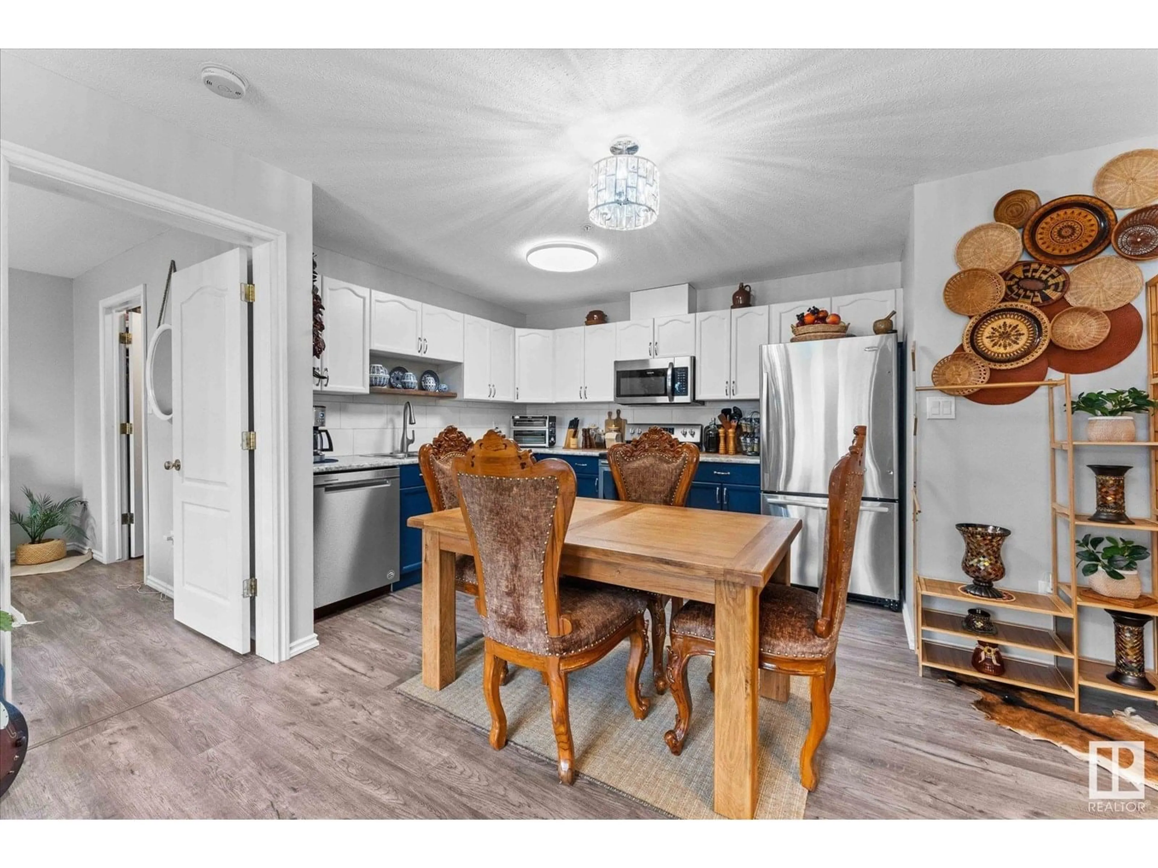 Open concept kitchen, wood/laminate floor for #102 - 4703 43 AV, Stony Plain Alberta T7Z2S7