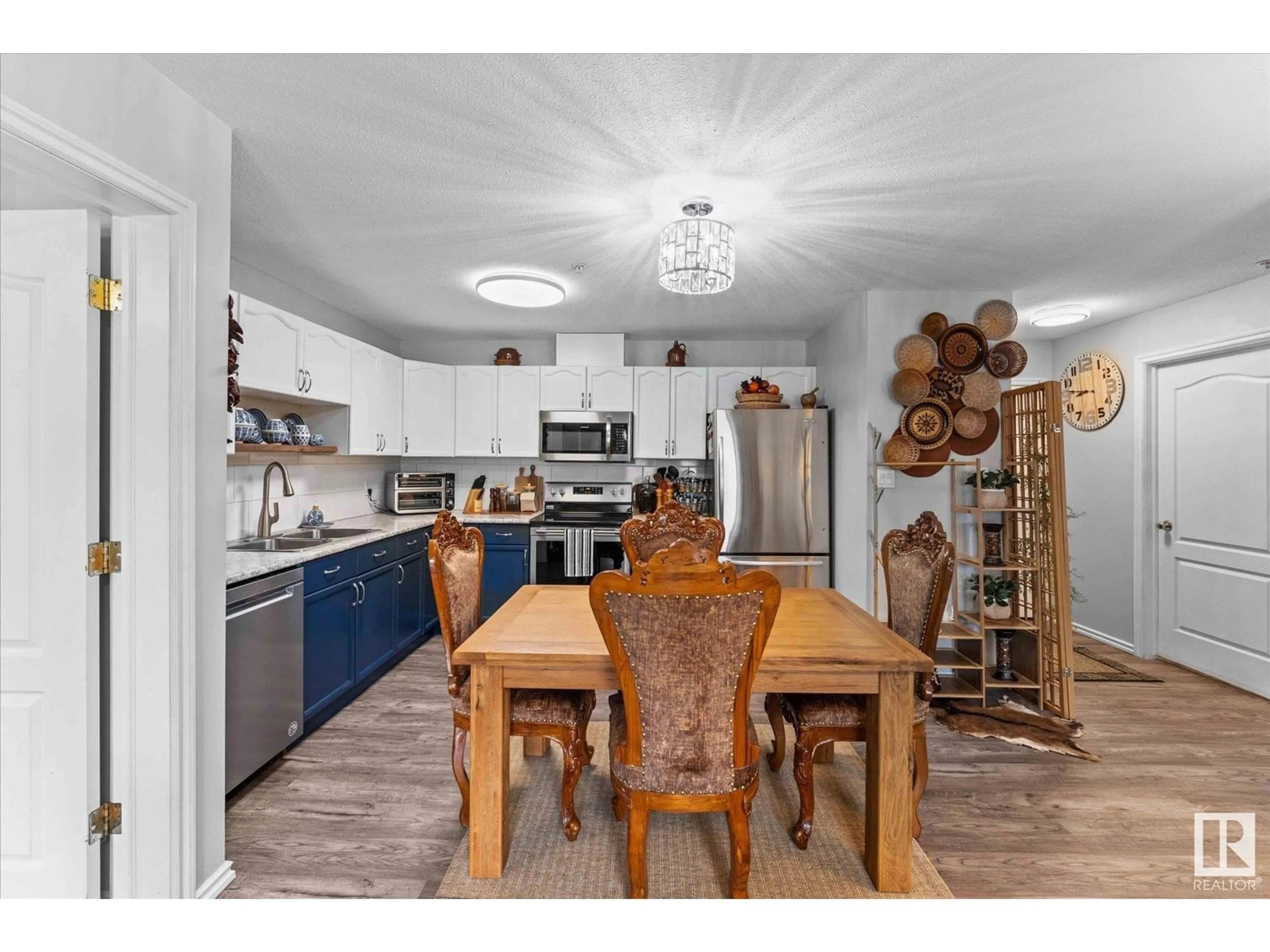 Open concept kitchen, wood/laminate floor for #102 - 4703 43 AV, Stony Plain Alberta T7Z2S7
