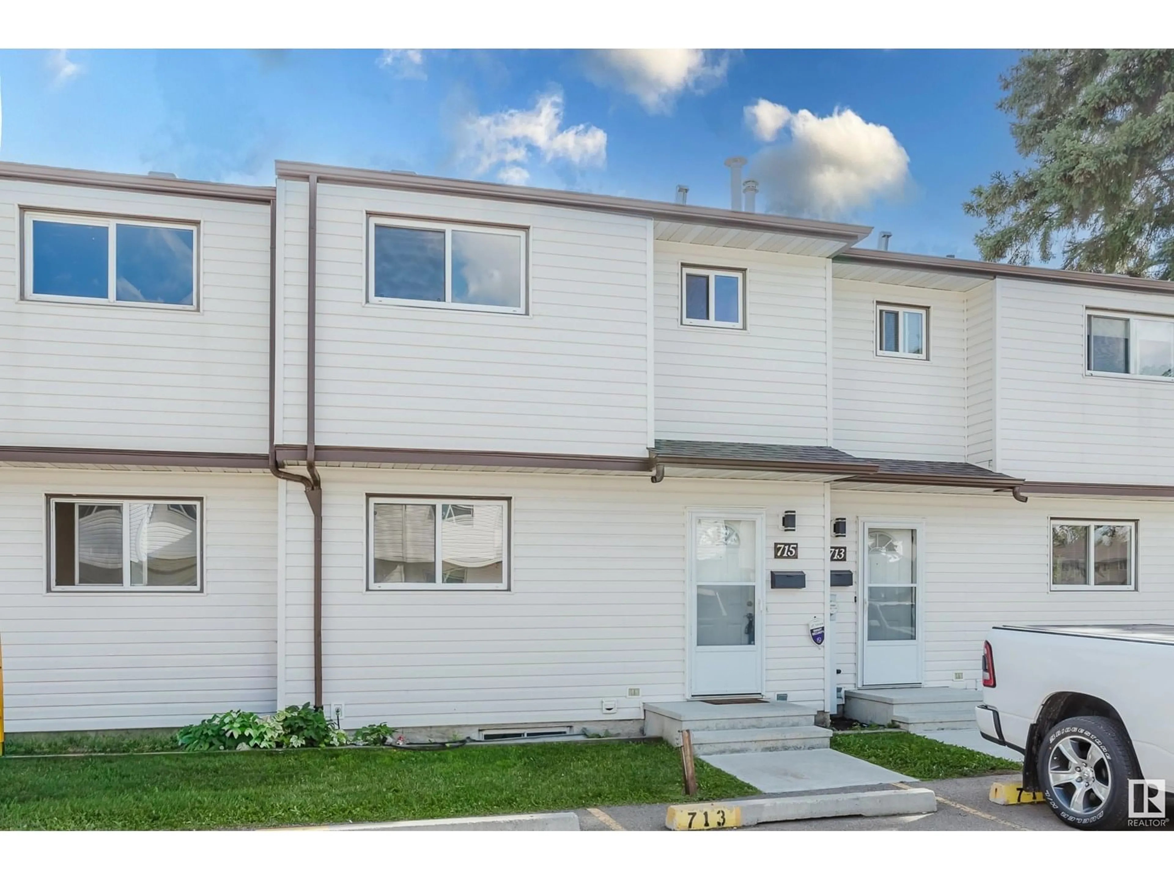 Home with vinyl exterior material, street for 715 CLAREVIEW RD, Edmonton Alberta T5A3S6