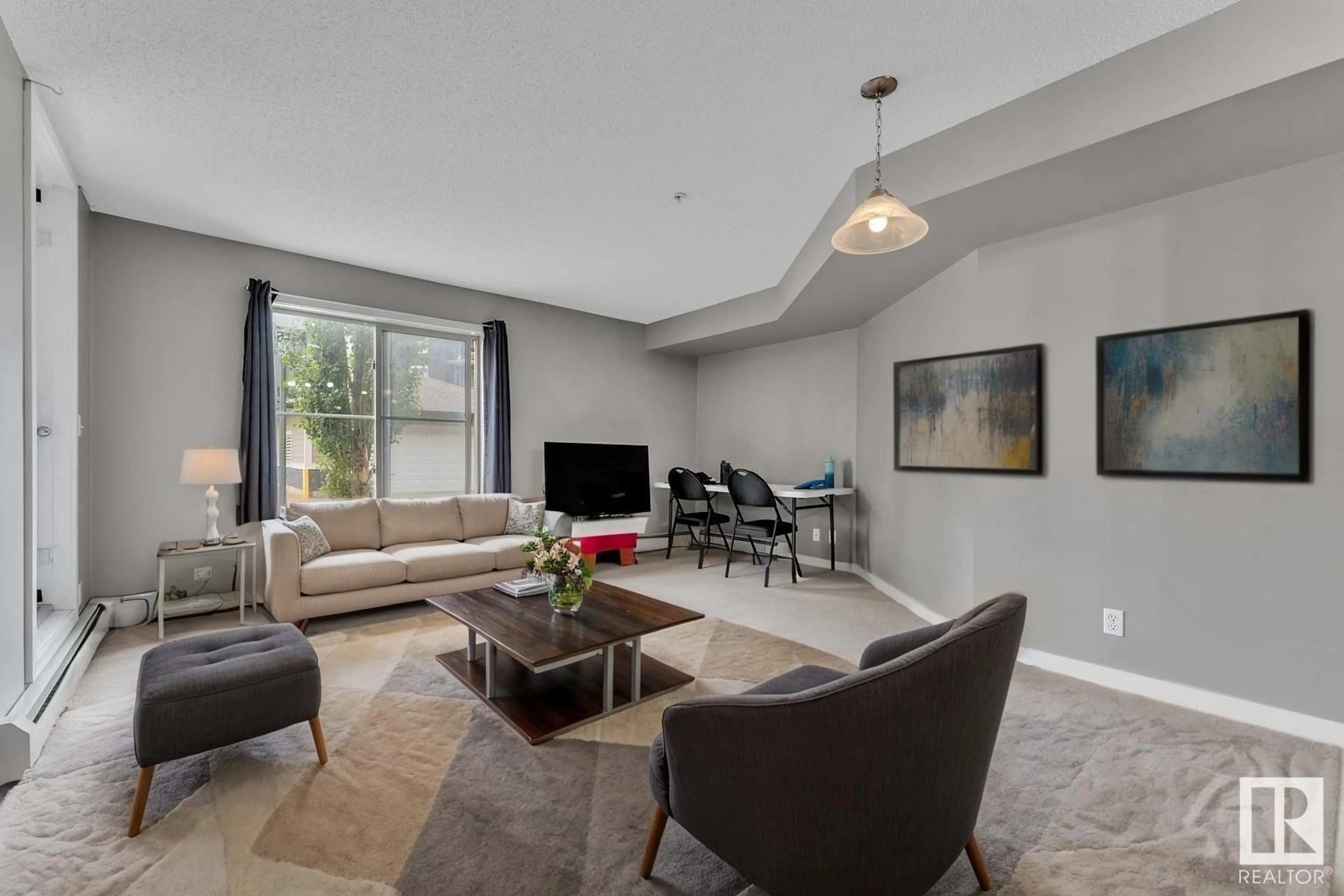 Living room with furniture, unknown for #103 - 107 WATT CM, Edmonton Alberta T6X2C6