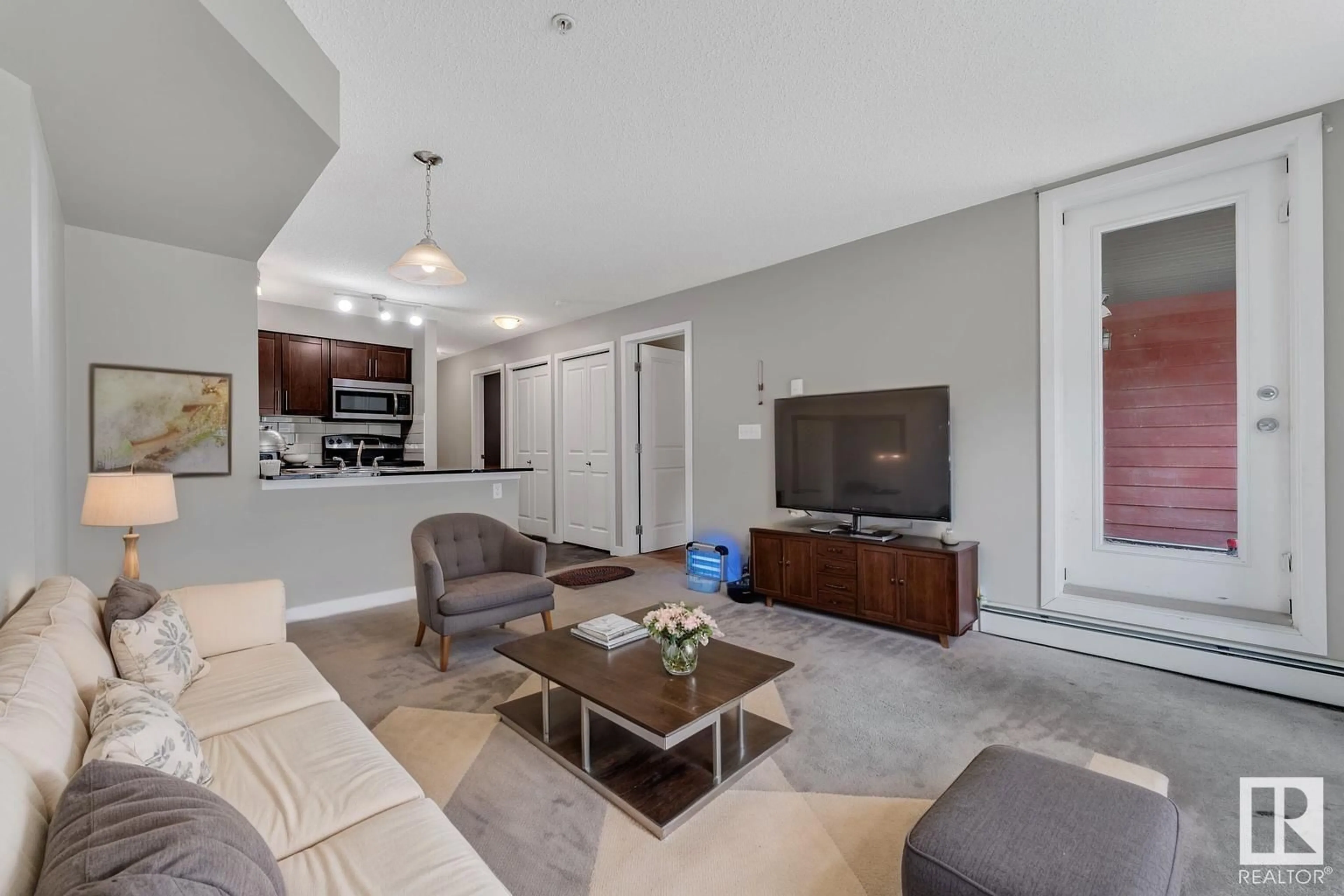 Living room with furniture, unknown for #103 - 107 WATT CM, Edmonton Alberta T6X2C6