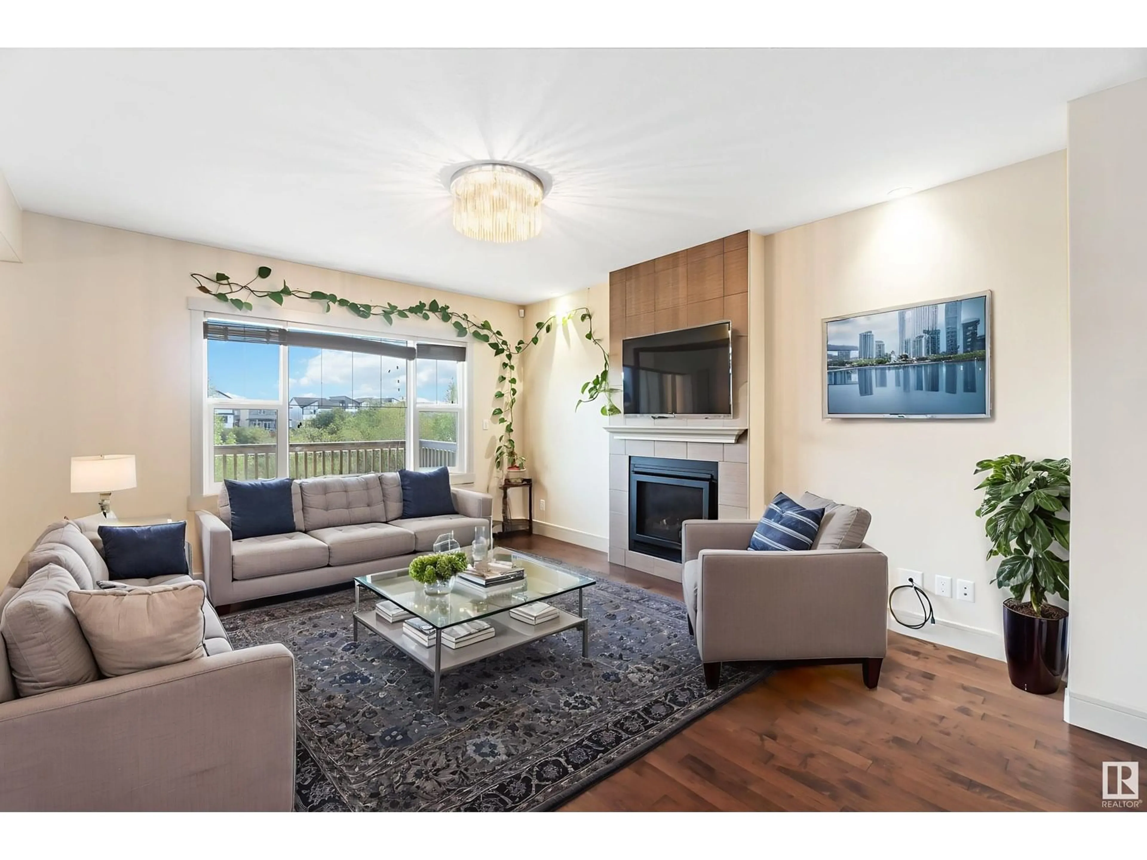 Living room with furniture, wood/laminate floor for 3434 PARKER LOOP, Edmonton Alberta T6W2W9