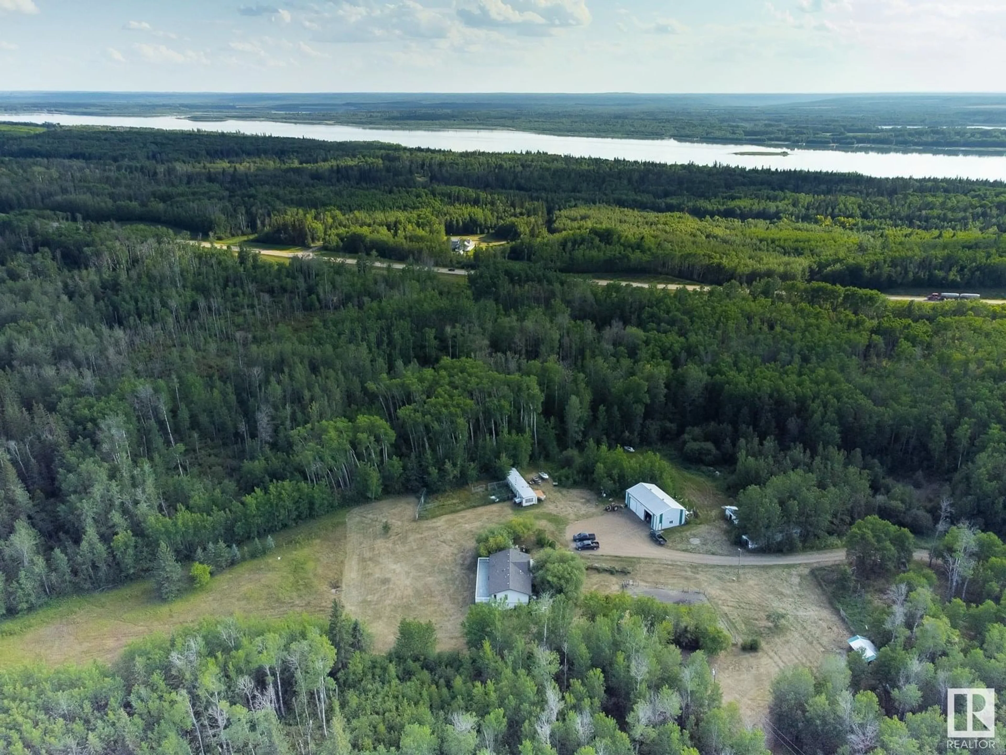 A pic from outside/outdoor area/front of a property/back of a property/a pic from drone, water/lake/river/ocean view for 11219 TOWNSHIP ROAD 640 A, Rural Lac La Biche County Alberta T0A2C0