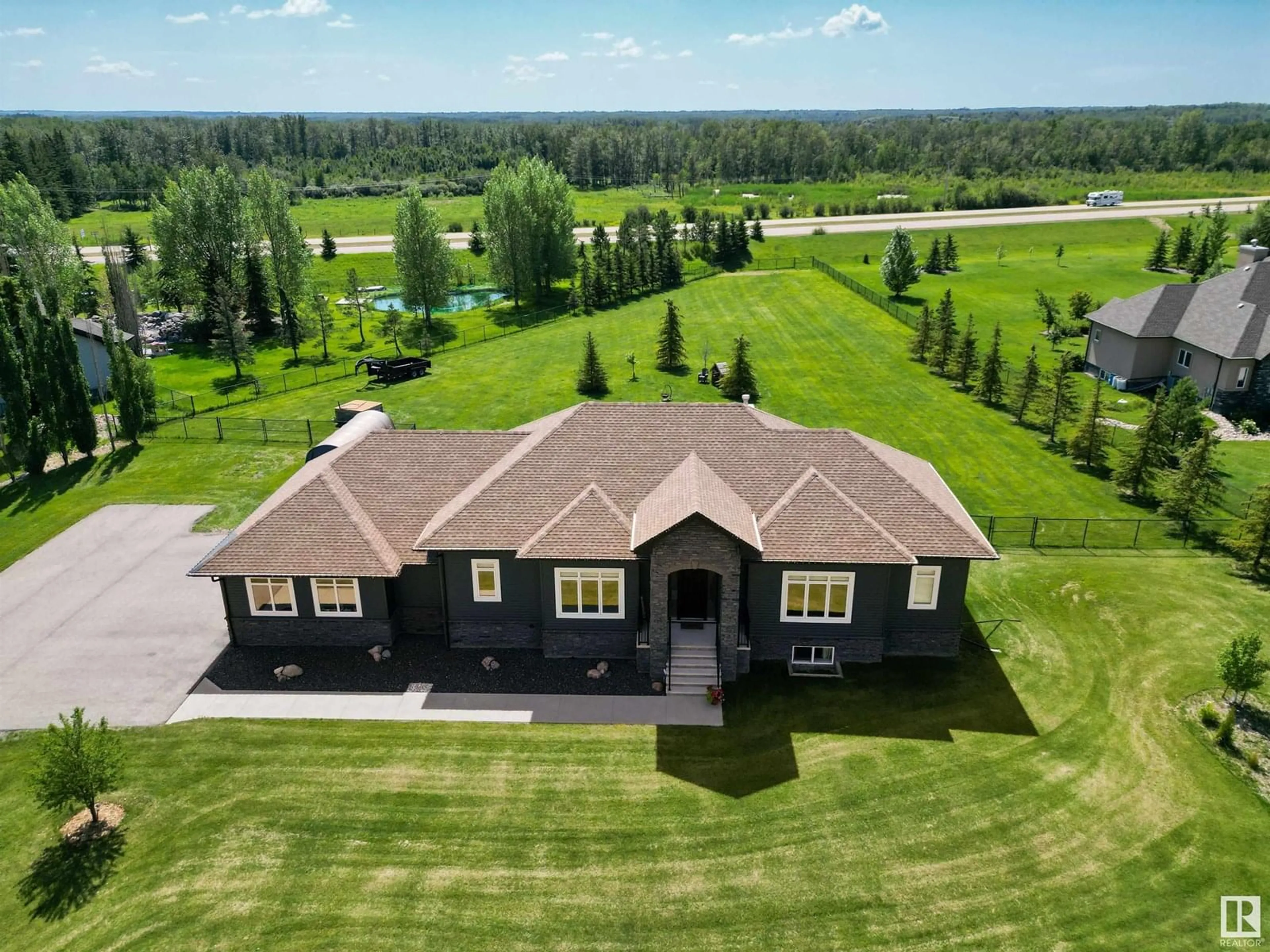 A pic from outside/outdoor area/front of a property/back of a property/a pic from drone, unknown for 385 52422 RGE ROAD 224, Rural Strathcona County Alberta T8A6N1