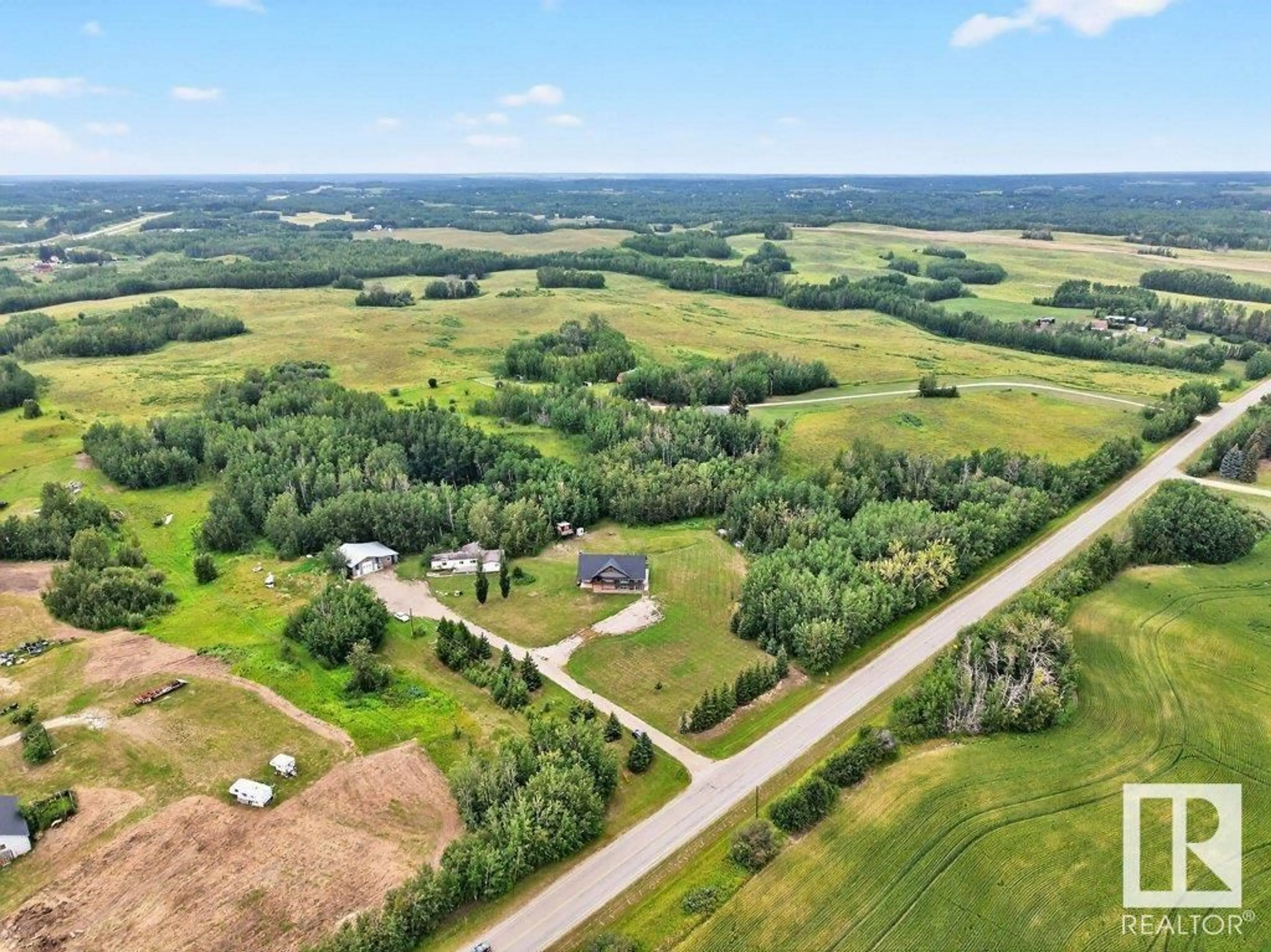 A pic from outside/outdoor area/front of a property/back of a property/a pic from drone, water/lake/river/ocean view for 53004 RGE ROAD 13, Rural Parkland County Alberta T7Y2T2
