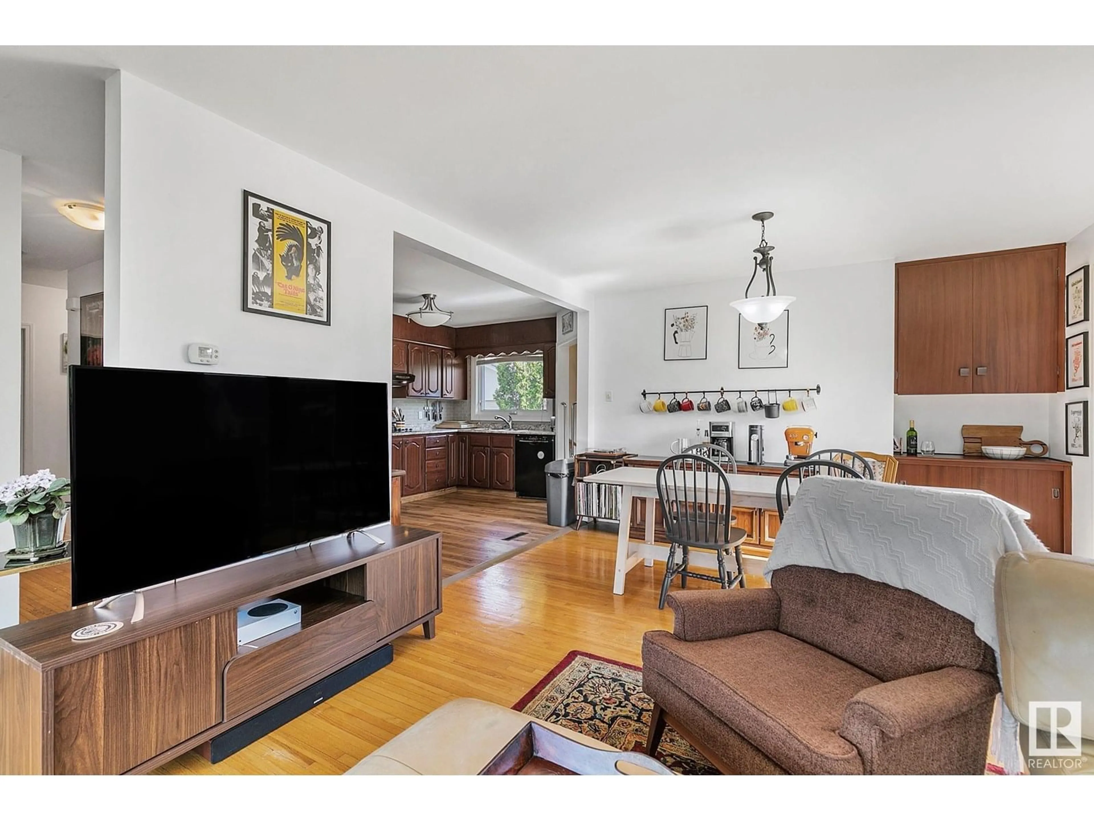 Living room with furniture, wood/laminate floor for 15614 81 AV, Edmonton Alberta T5R3P4