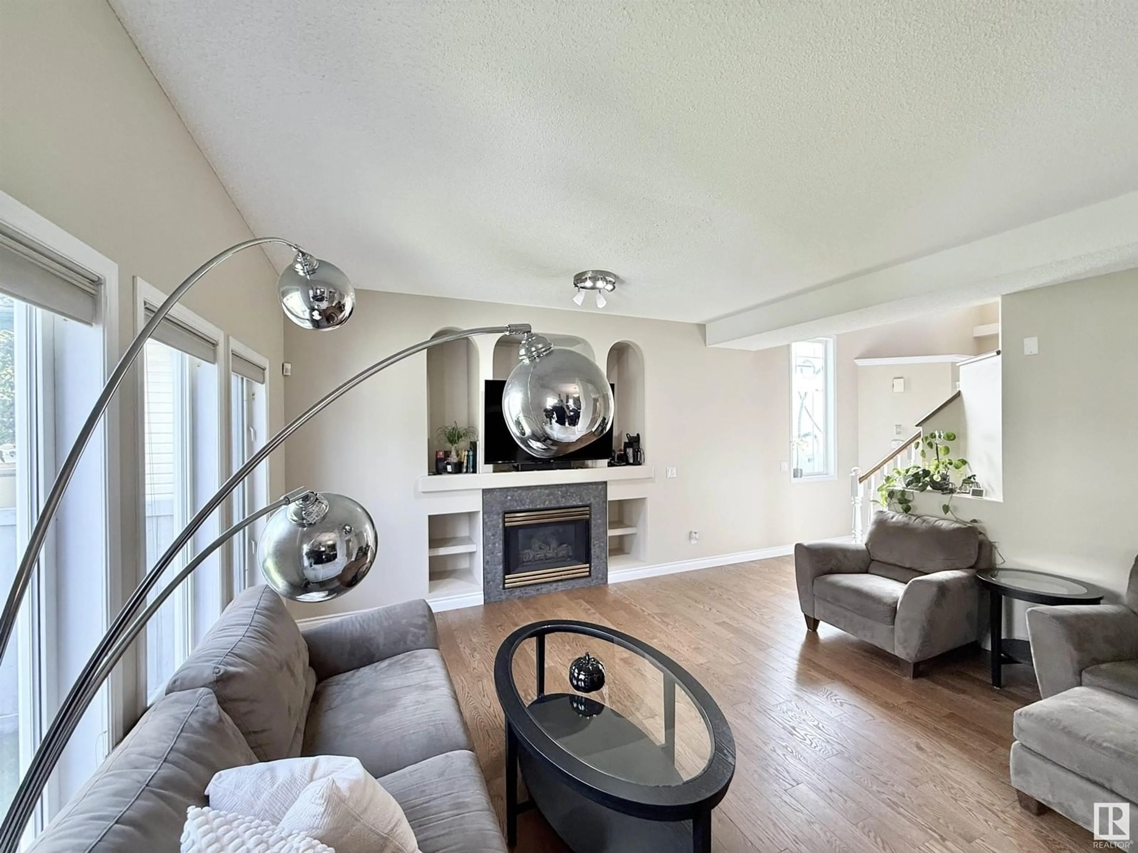 Living room with furniture, wood/laminate floor for NW - 706 ORMSBY W, Edmonton Alberta T5T6E4
