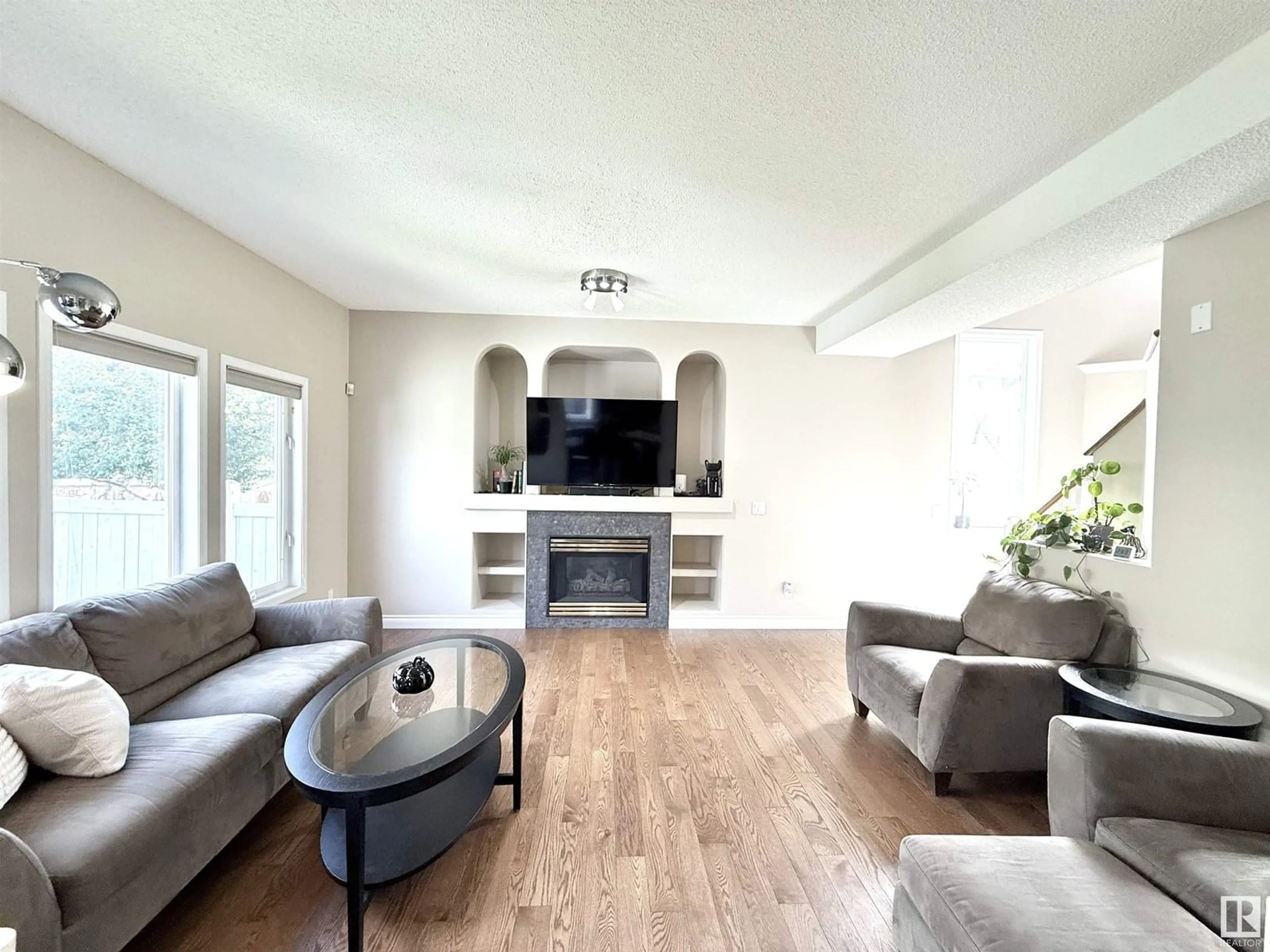 Living room with furniture, wood/laminate floor for NW - 706 ORMSBY W, Edmonton Alberta T5T6E4