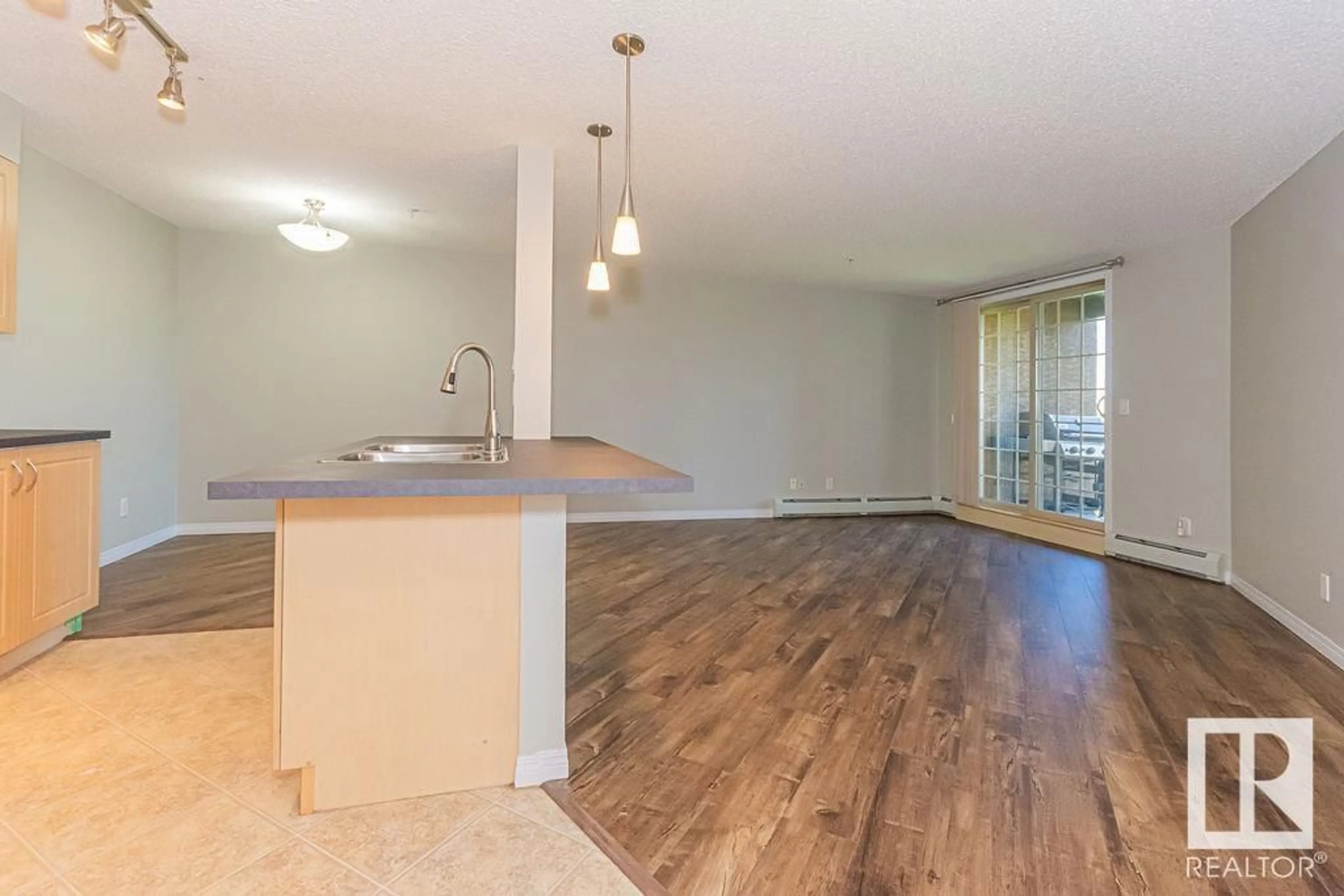 Open concept kitchen, wood/laminate floor for #311 - 11453 ELLERSLIE RD, Edmonton Alberta T6W1T3