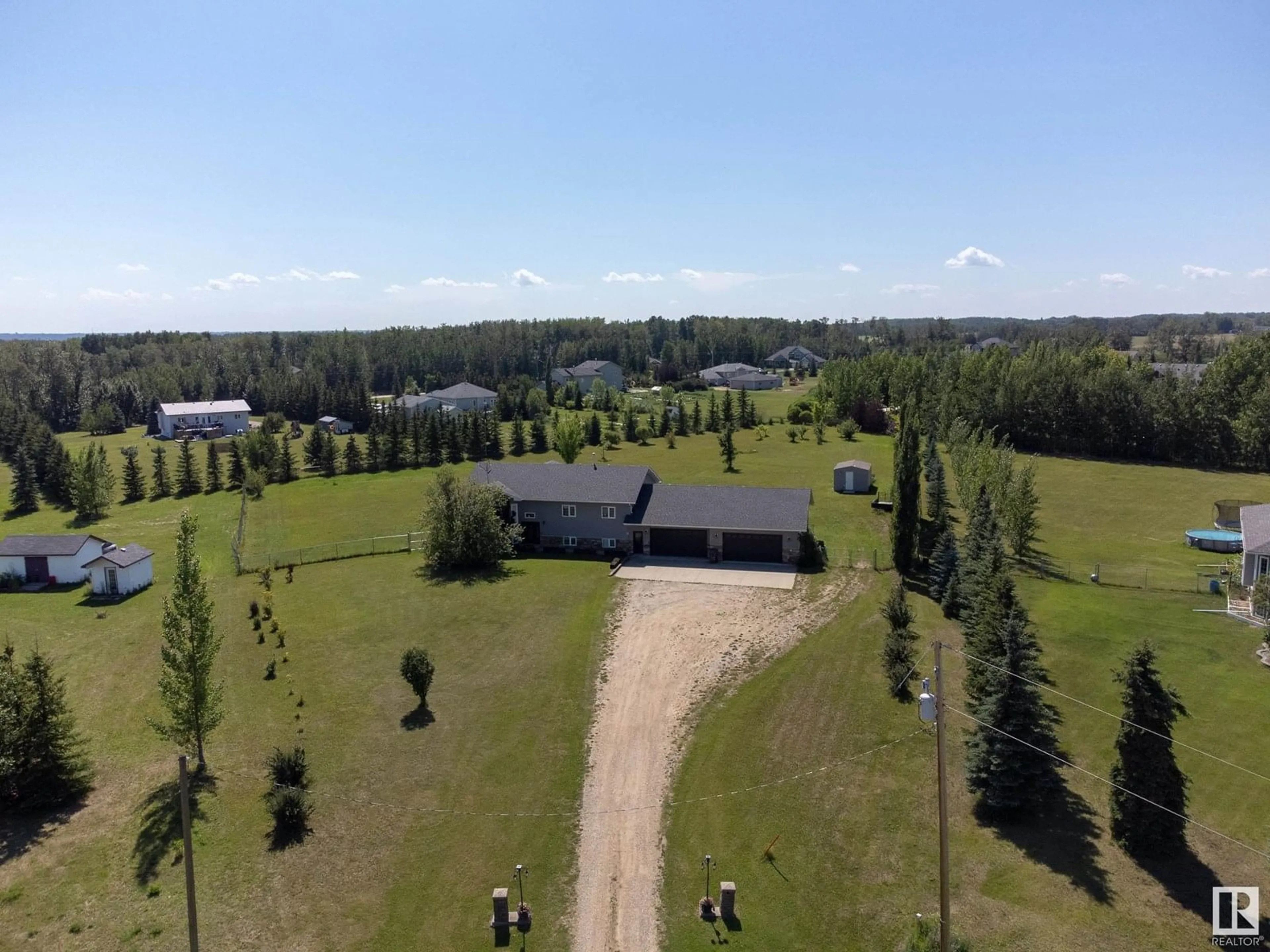 A pic from outside/outdoor area/front of a property/back of a property/a pic from drone, forest/trees view for 53522 - 42 RGE ROAD 272, Rural Parkland County Alberta T7X3N2