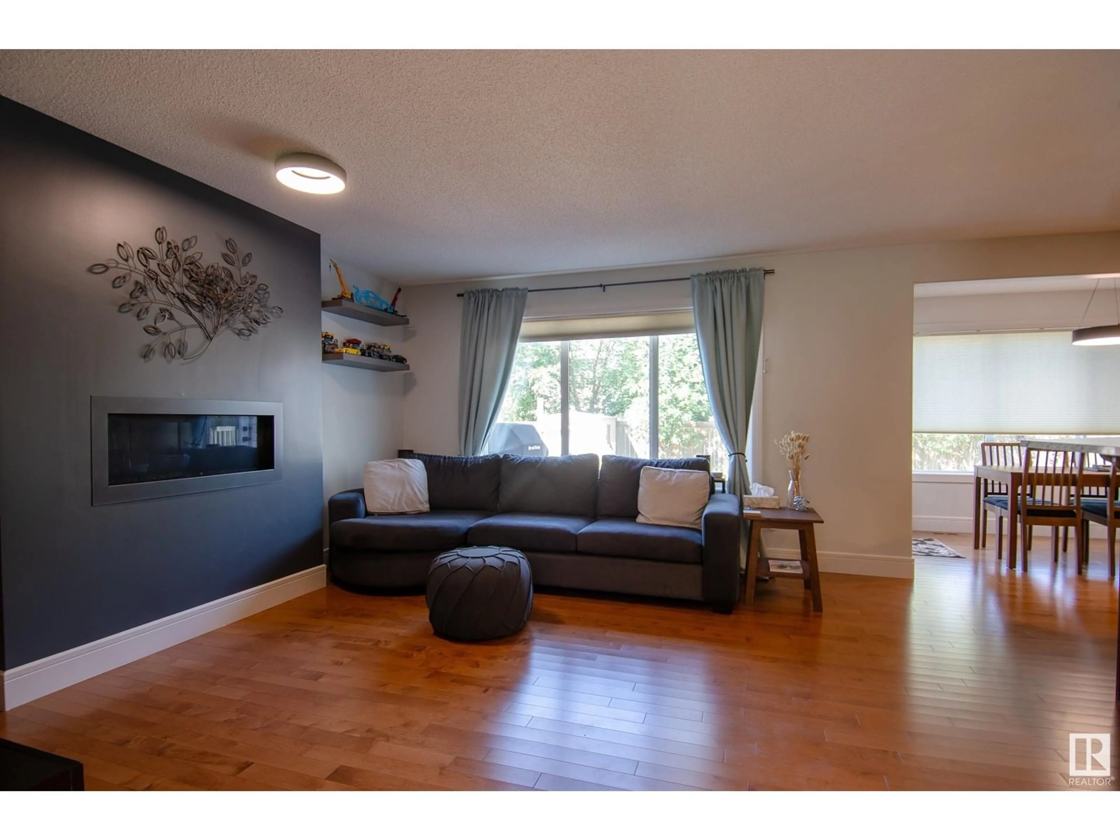 Living room with furniture, wood/laminate floor for 45 SPRING GROVE CR, Spruce Grove Alberta T7X0L5