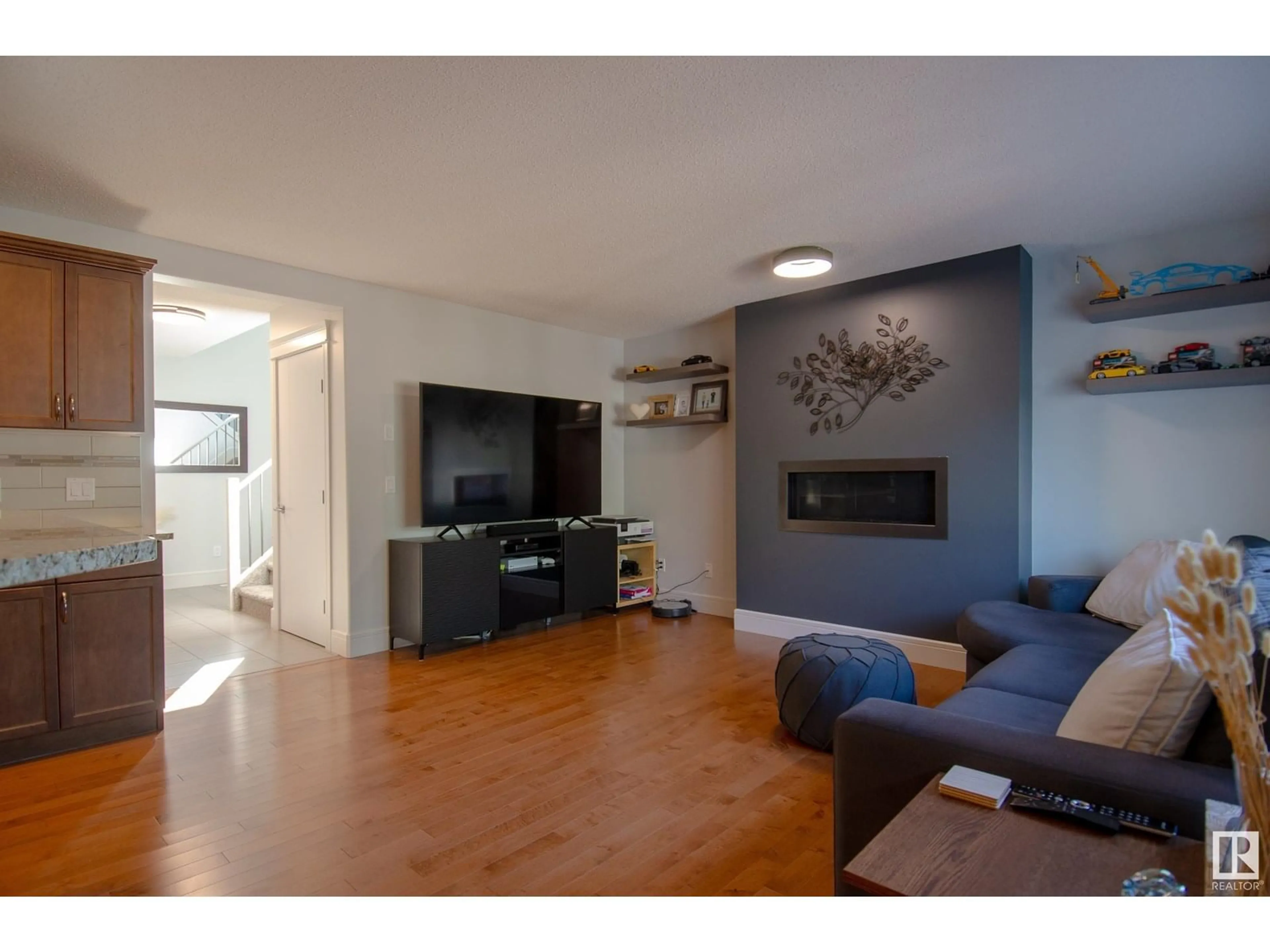 Living room with furniture, wood/laminate floor for 45 SPRING GROVE CR, Spruce Grove Alberta T7X0L5