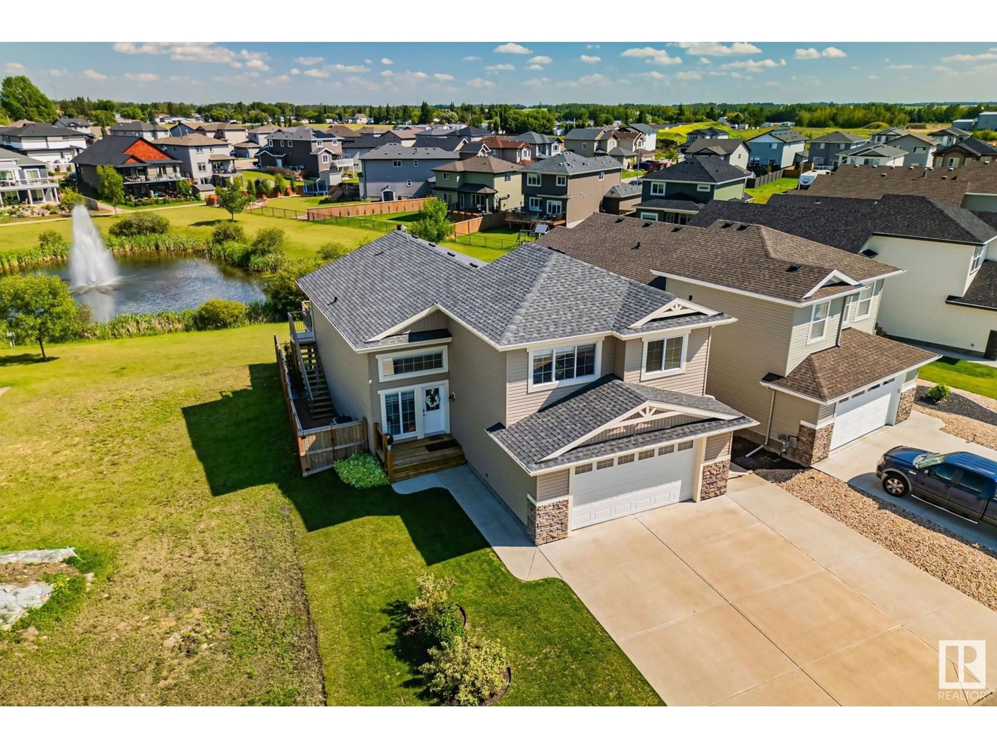 A pic from outside/outdoor area/front of a property/back of a property/a pic from drone, water/lake/river/ocean view for 17 SOUTHBRIDGE DR, Calmar Alberta T0C0V0