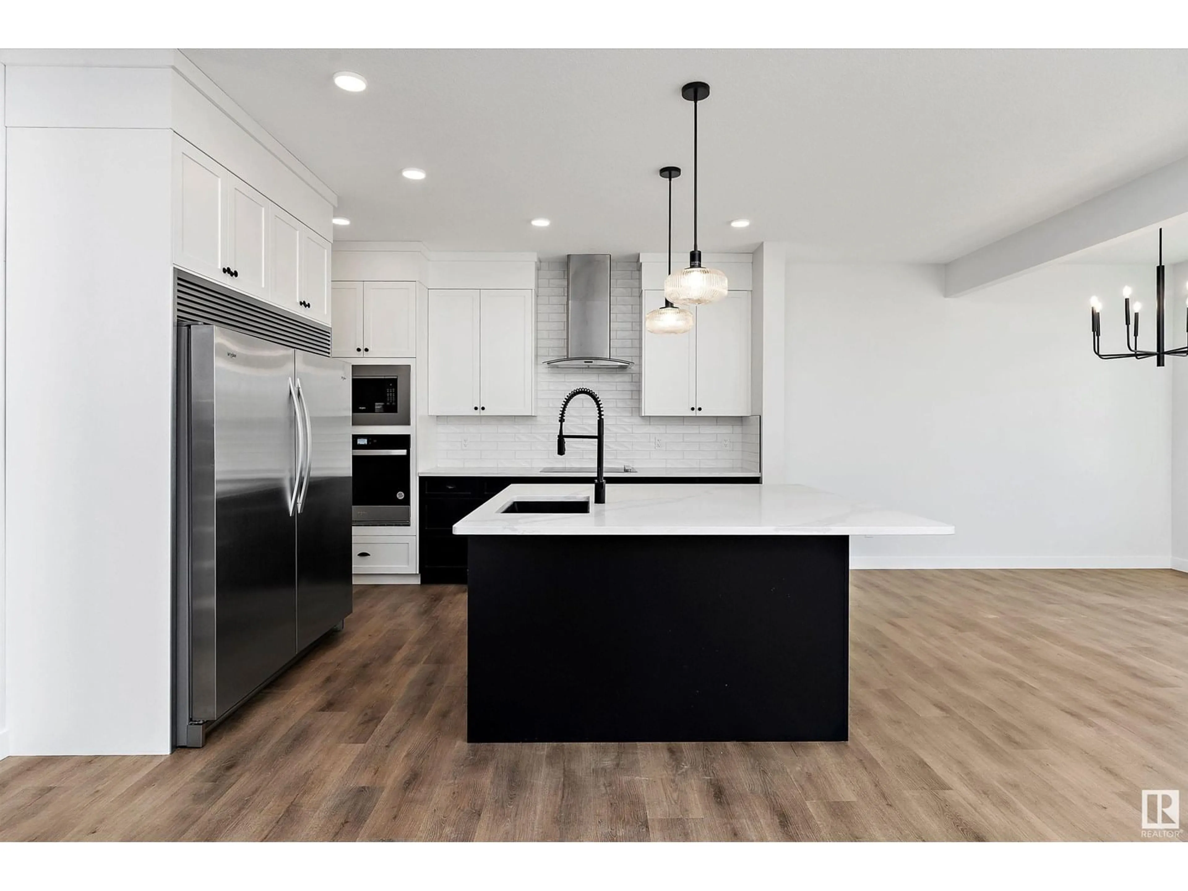 Open concept kitchen, wood/laminate floor for NW - 22 NEWBURY CI, Sherwood Park Alberta T8B0E9