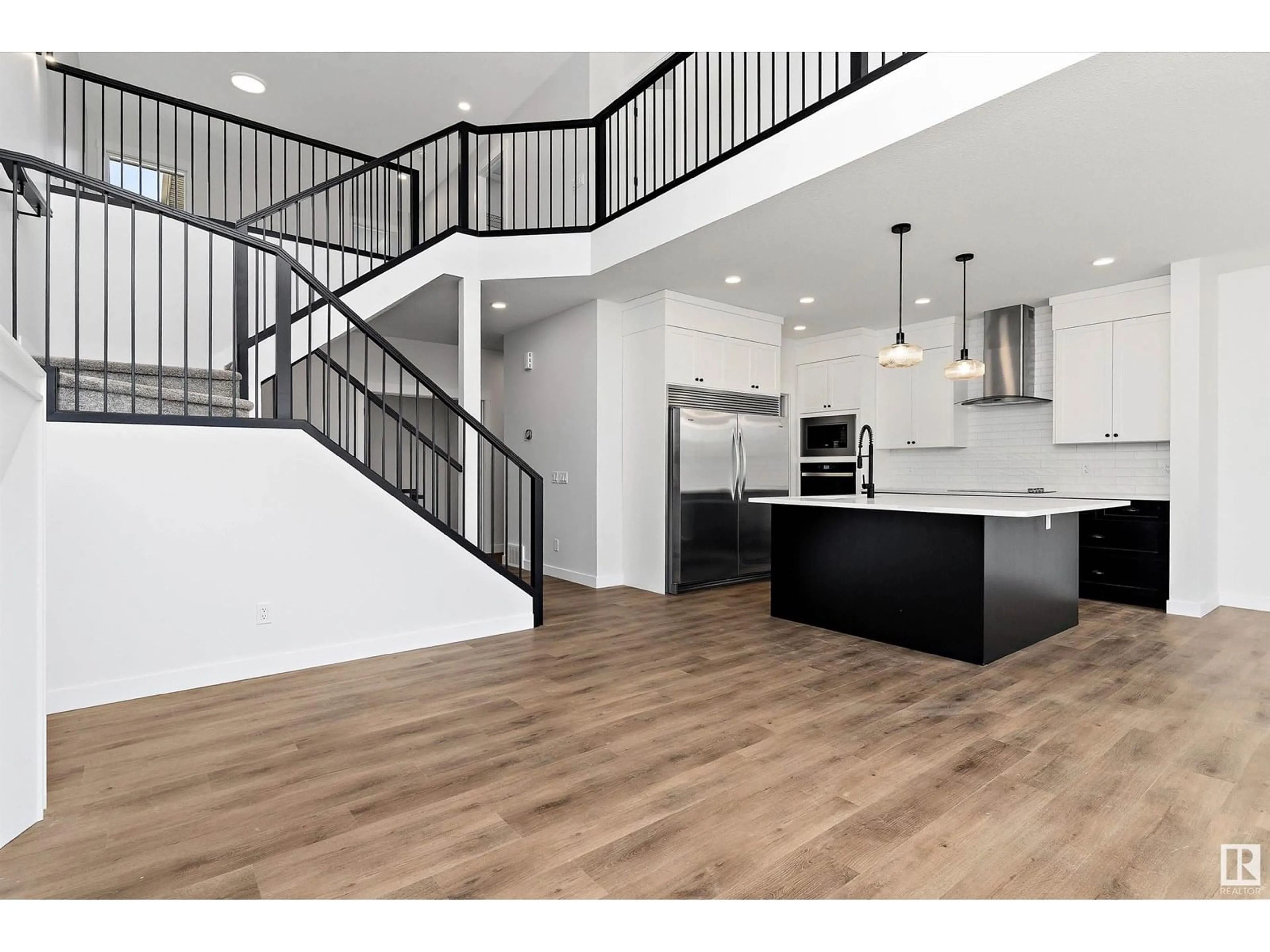 Open concept kitchen, wood/laminate floor for NW - 22 NEWBURY CI, Sherwood Park Alberta T8B0E9