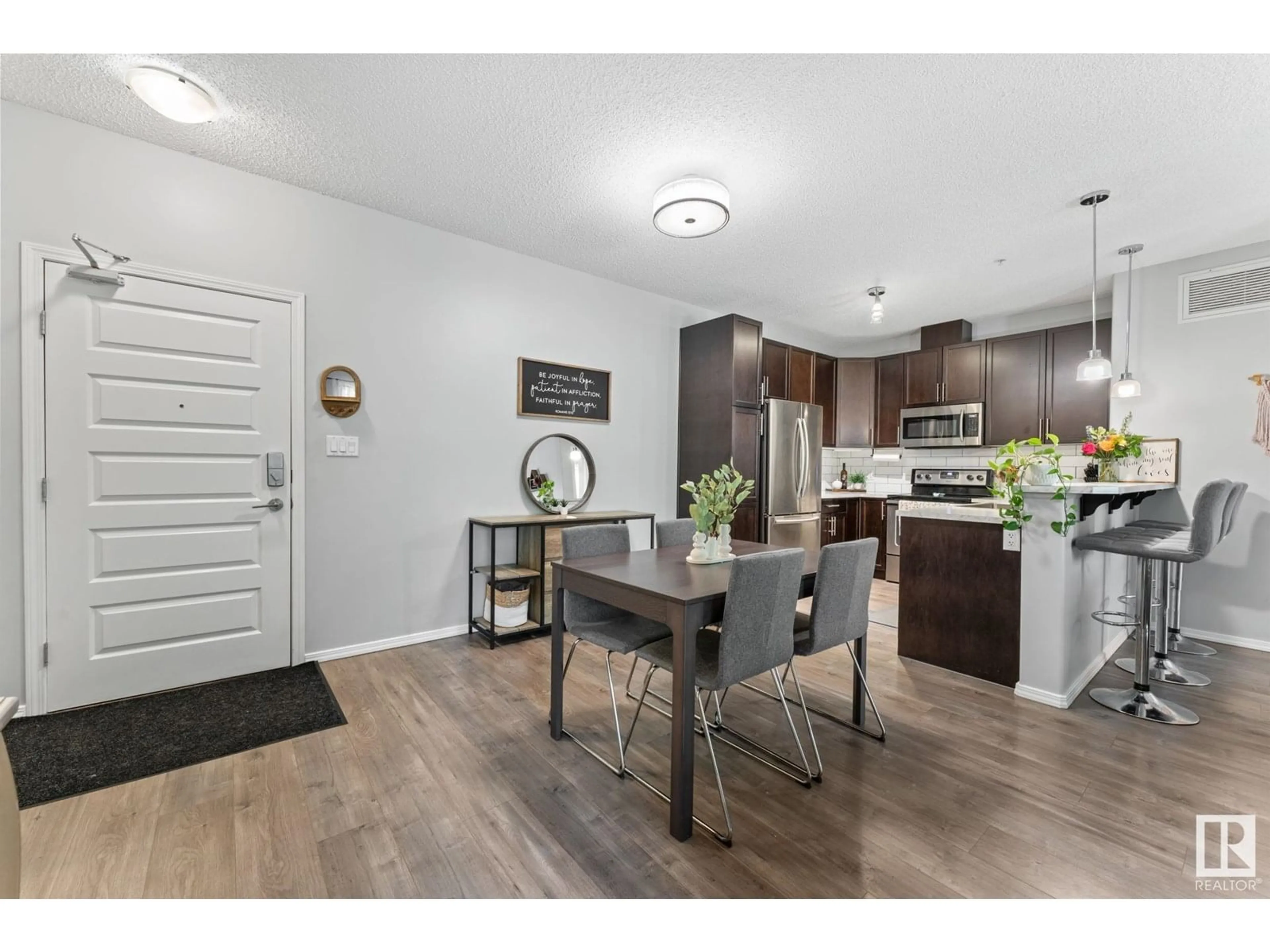 Open concept kitchen, wood/laminate floor for NW - 244 7825 71 ST, Edmonton Alberta T6B3R9