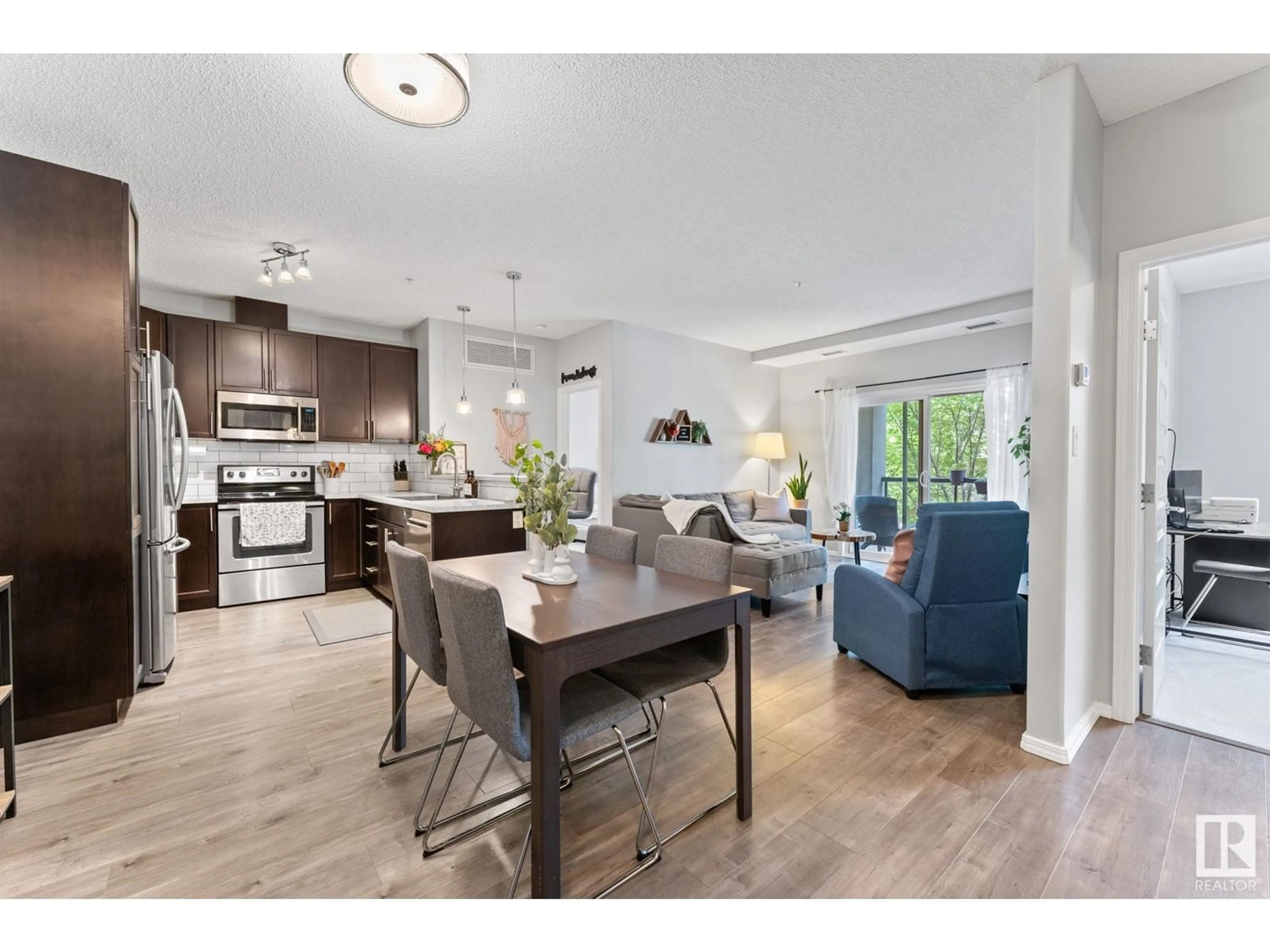 Open concept kitchen, wood/laminate floor for NW - 244 7825 71 ST, Edmonton Alberta T6B3R9