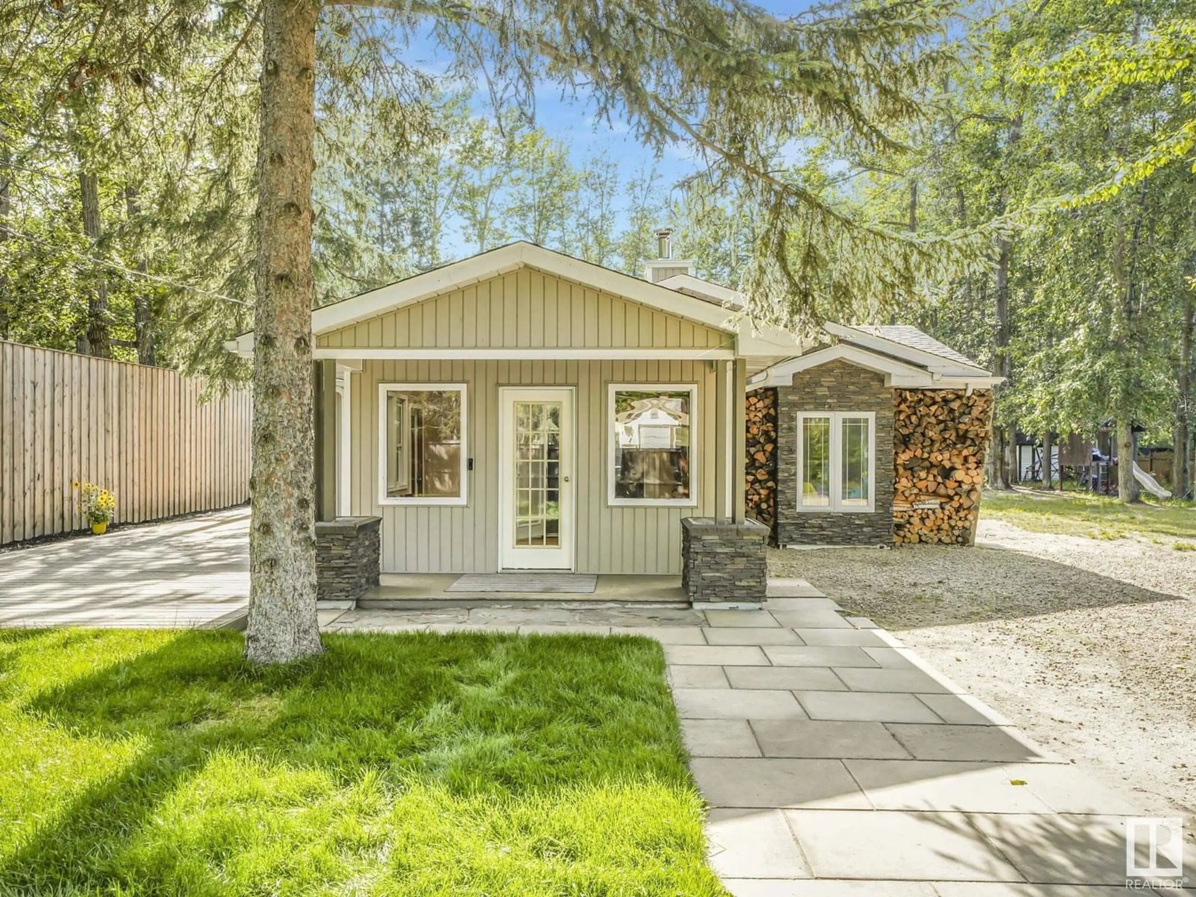 Home with vinyl exterior material, street for 614 - 55230 RGE ROAD 10, Rural Sturgeon County Alberta T8R0K4