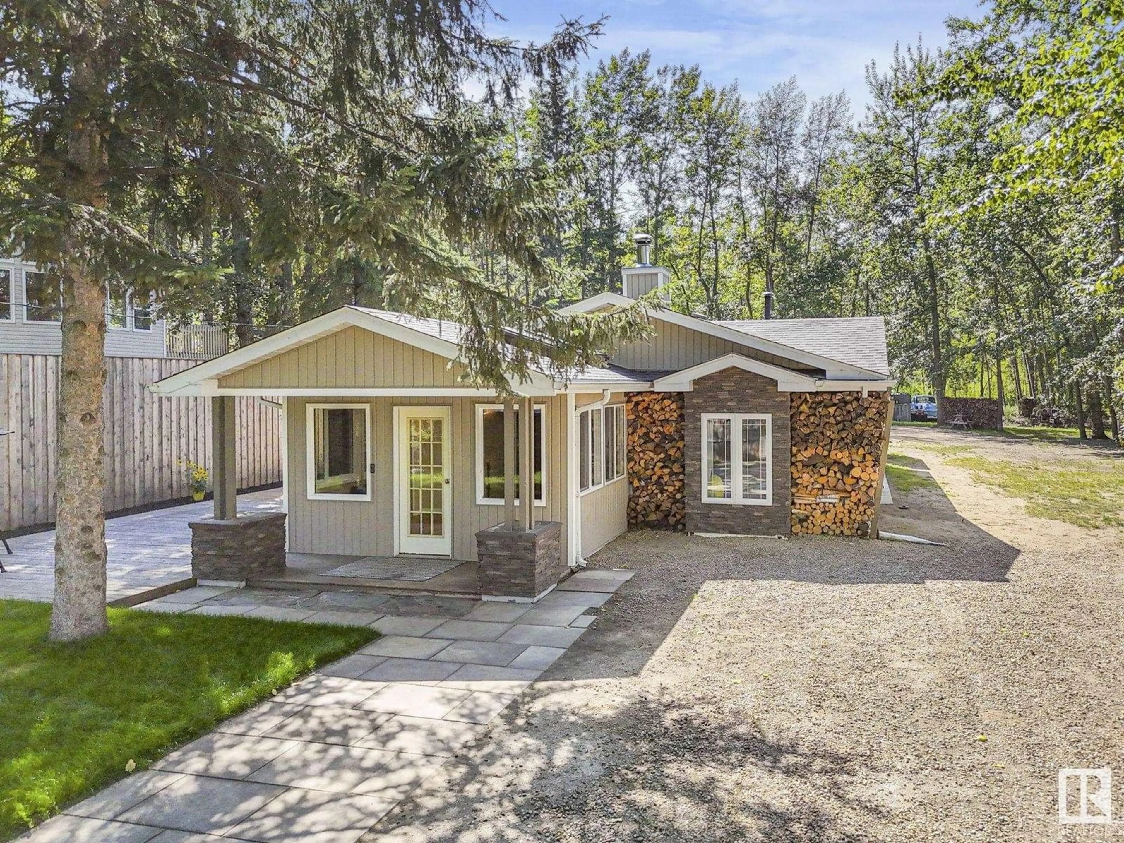 Home with vinyl exterior material, street for 614 - 55230 RGE ROAD 10, Rural Sturgeon County Alberta T8R0K4