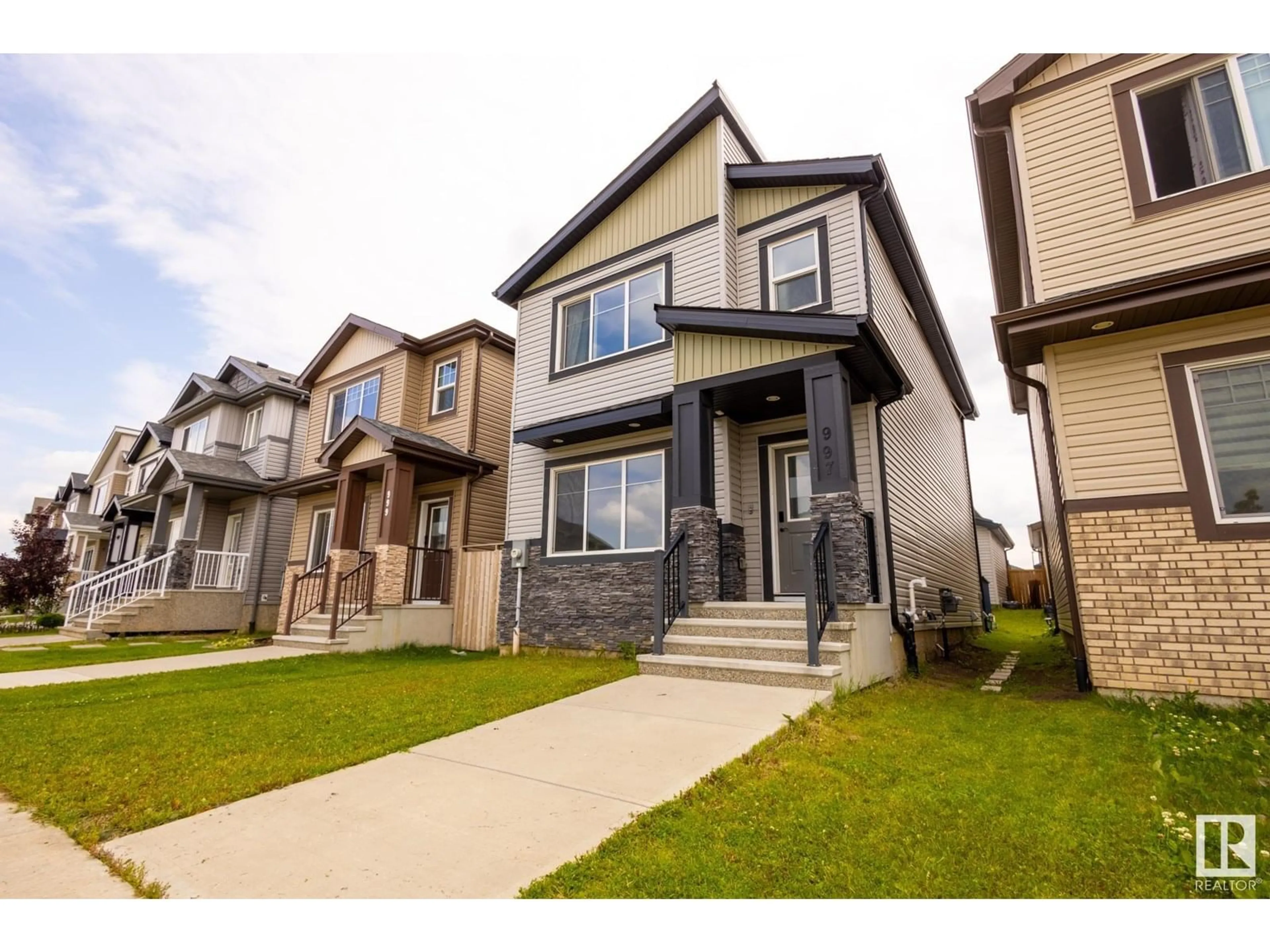 Home with vinyl exterior material, street for 997 MCCONACHIE BV, Edmonton Alberta T5Y3N3