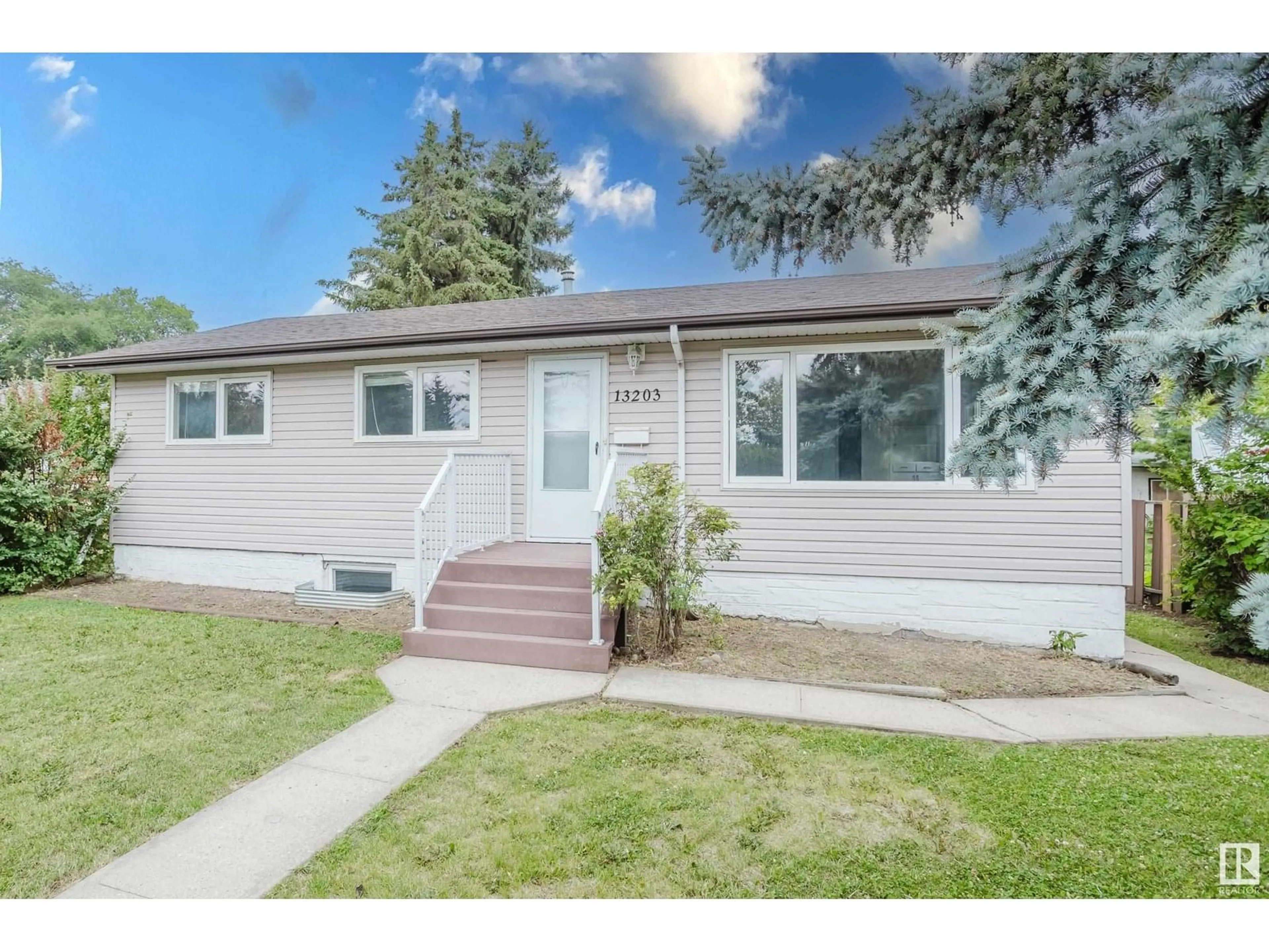 Home with vinyl exterior material, street for NW - 13203 140 ST, Edmonton Alberta T5L2E4