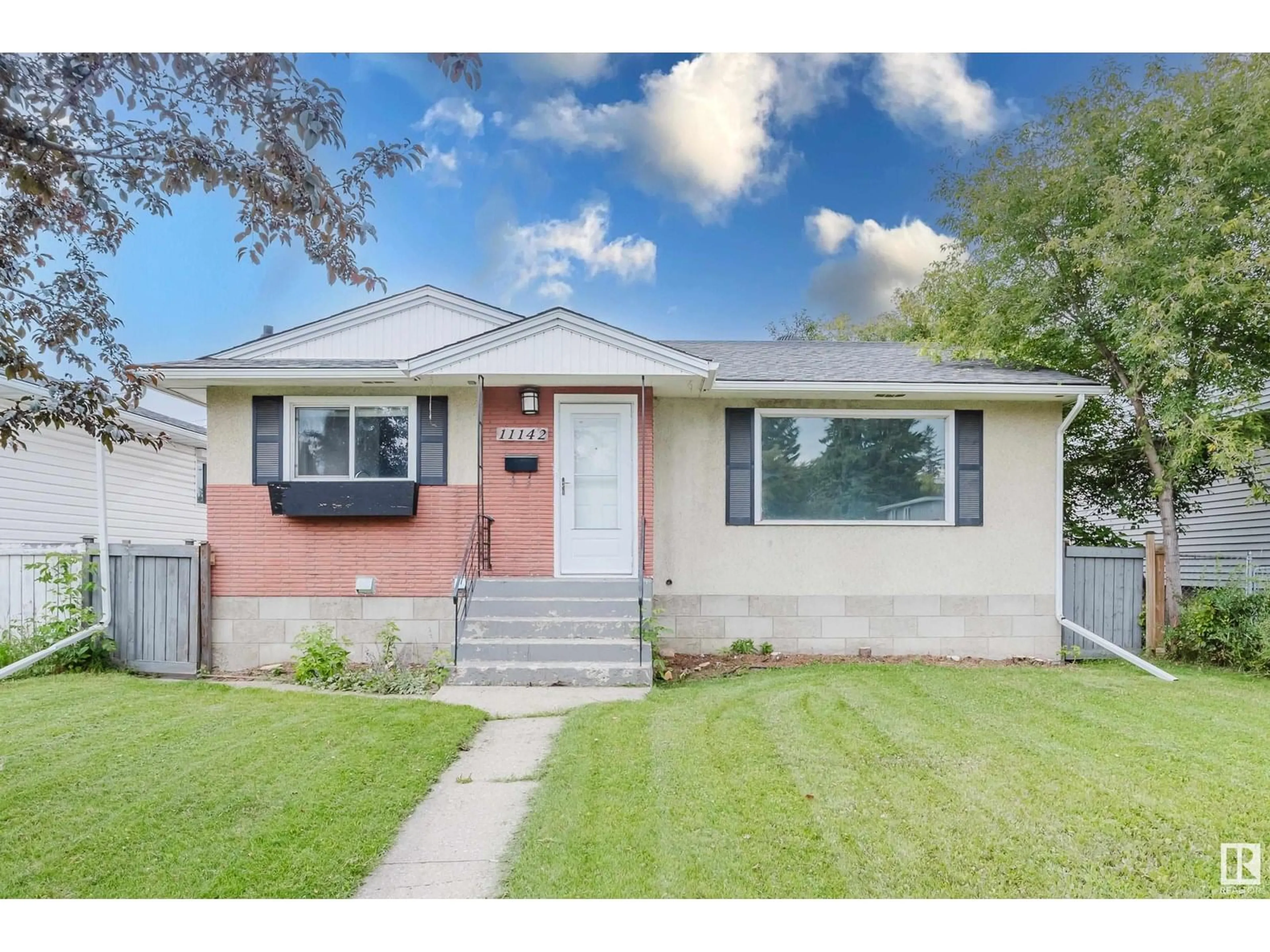 Home with vinyl exterior material, street for 11142 50 ST, Edmonton Alberta T5W3B2