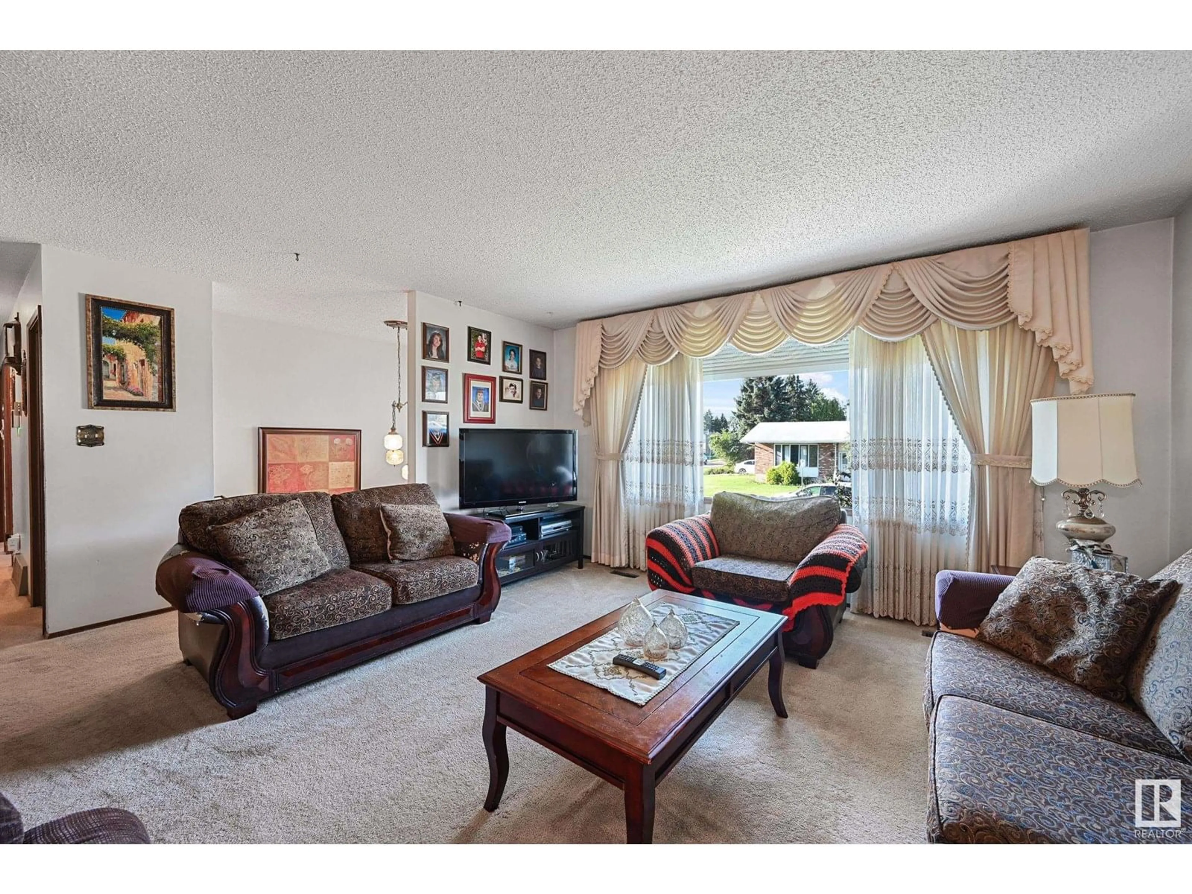 Living room with furniture, unknown for 9504 143 AV, Edmonton Alberta T5E2H3