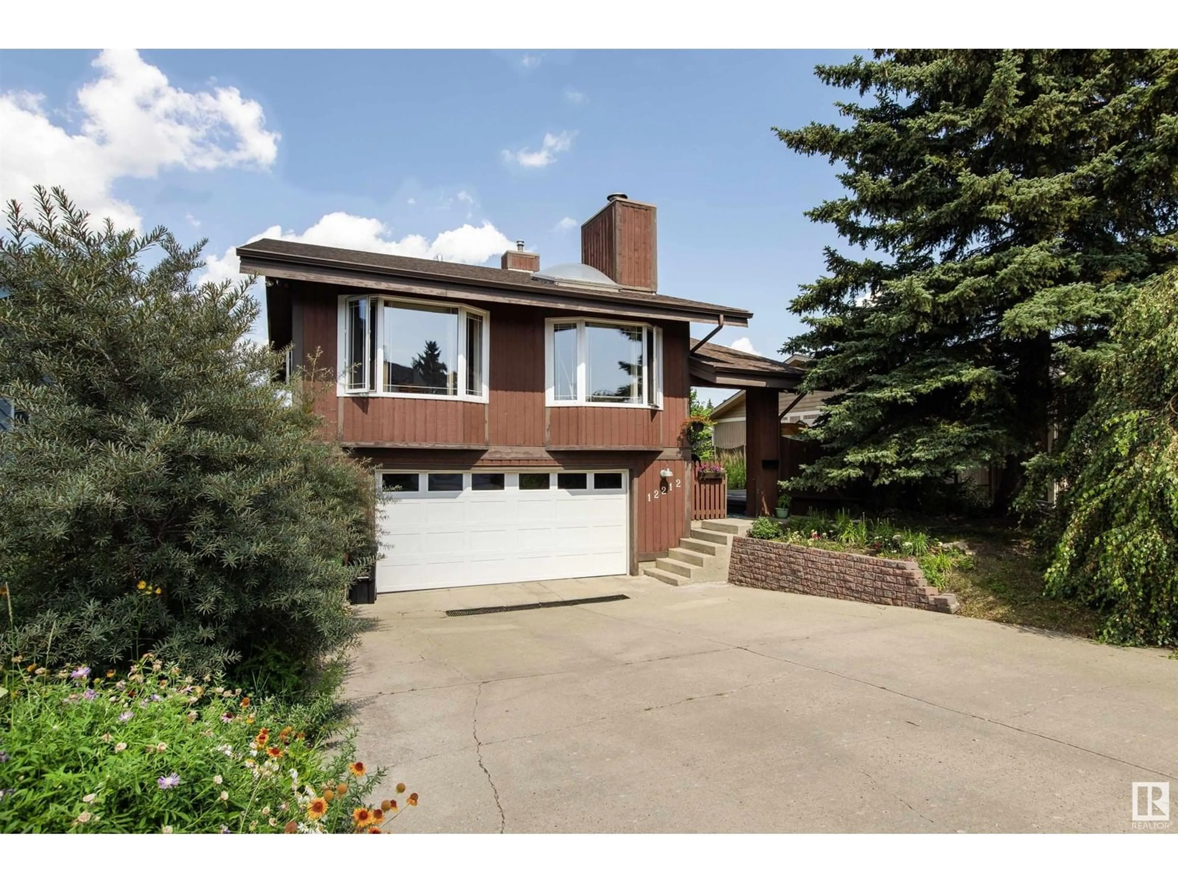 Home with brick exterior material, street for 12212 151 AV, Edmonton Alberta T5X4A6