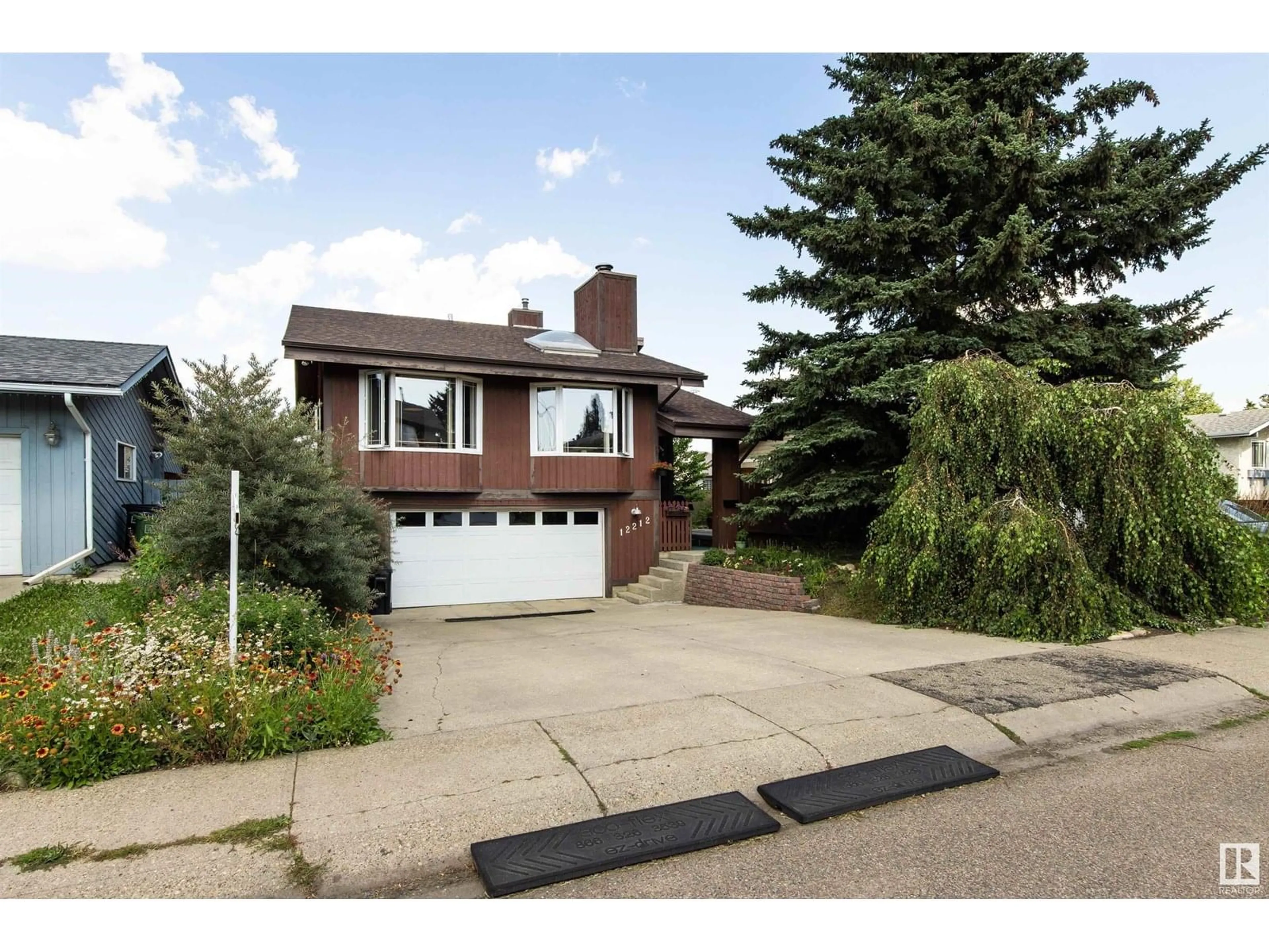 Home with brick exterior material, street for 12212 151 AV, Edmonton Alberta T5X4A6
