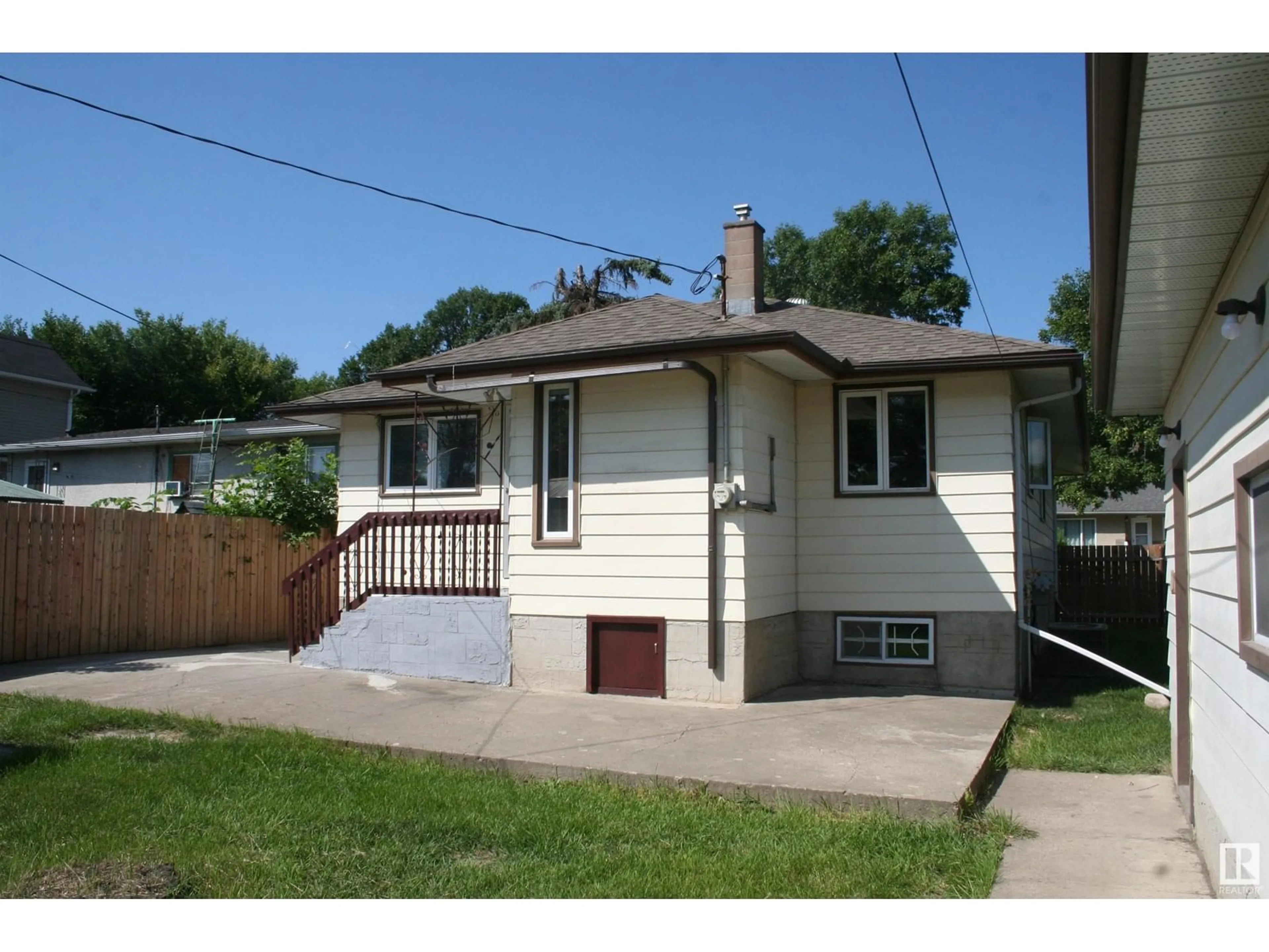 Home with vinyl exterior material, street for NW - 11823 43 ST, Edmonton Alberta T5W2P3