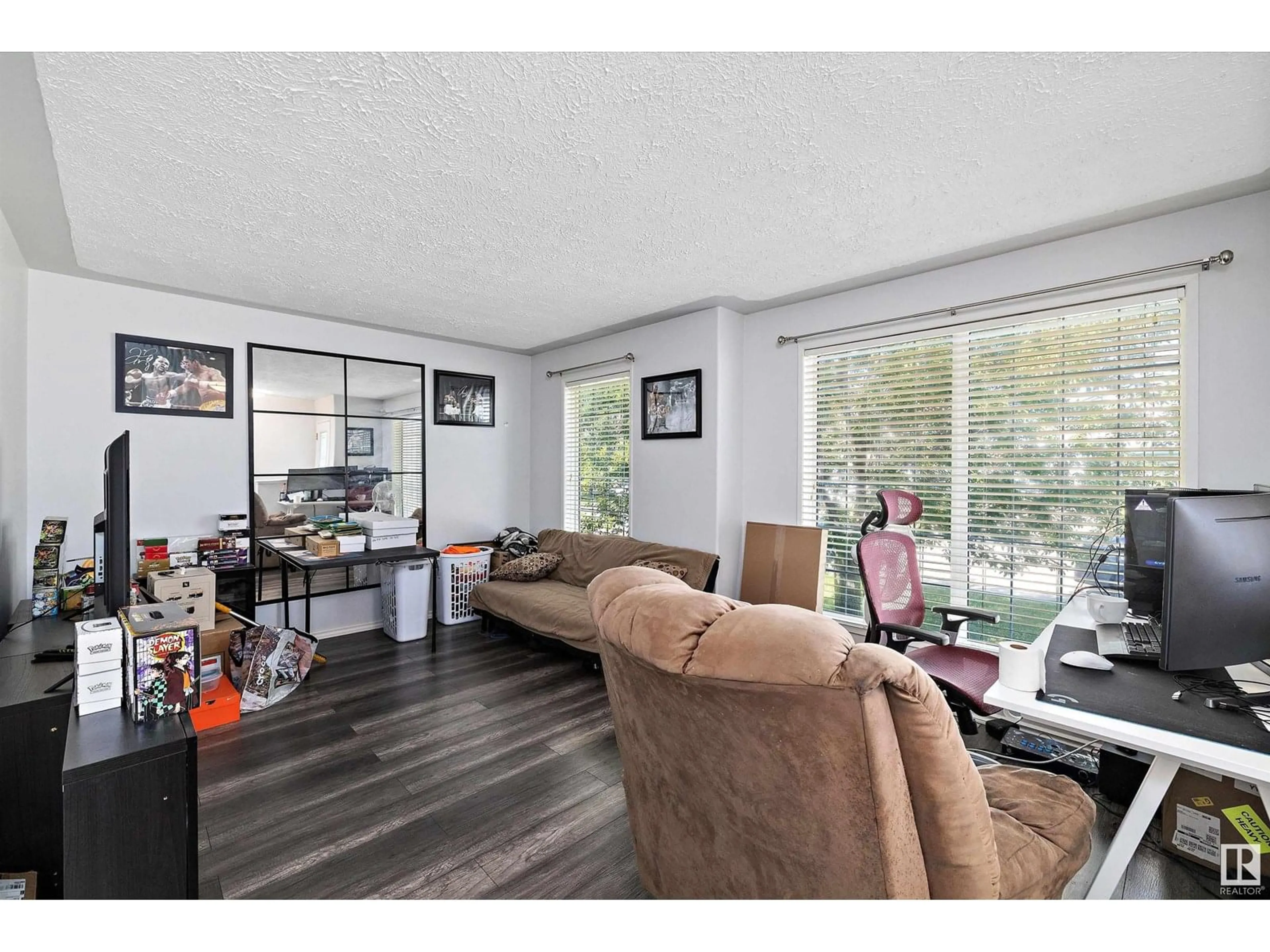 Living room with furniture, wood/laminate floor for 16229 57 ST, Edmonton Alberta T5Y2V2